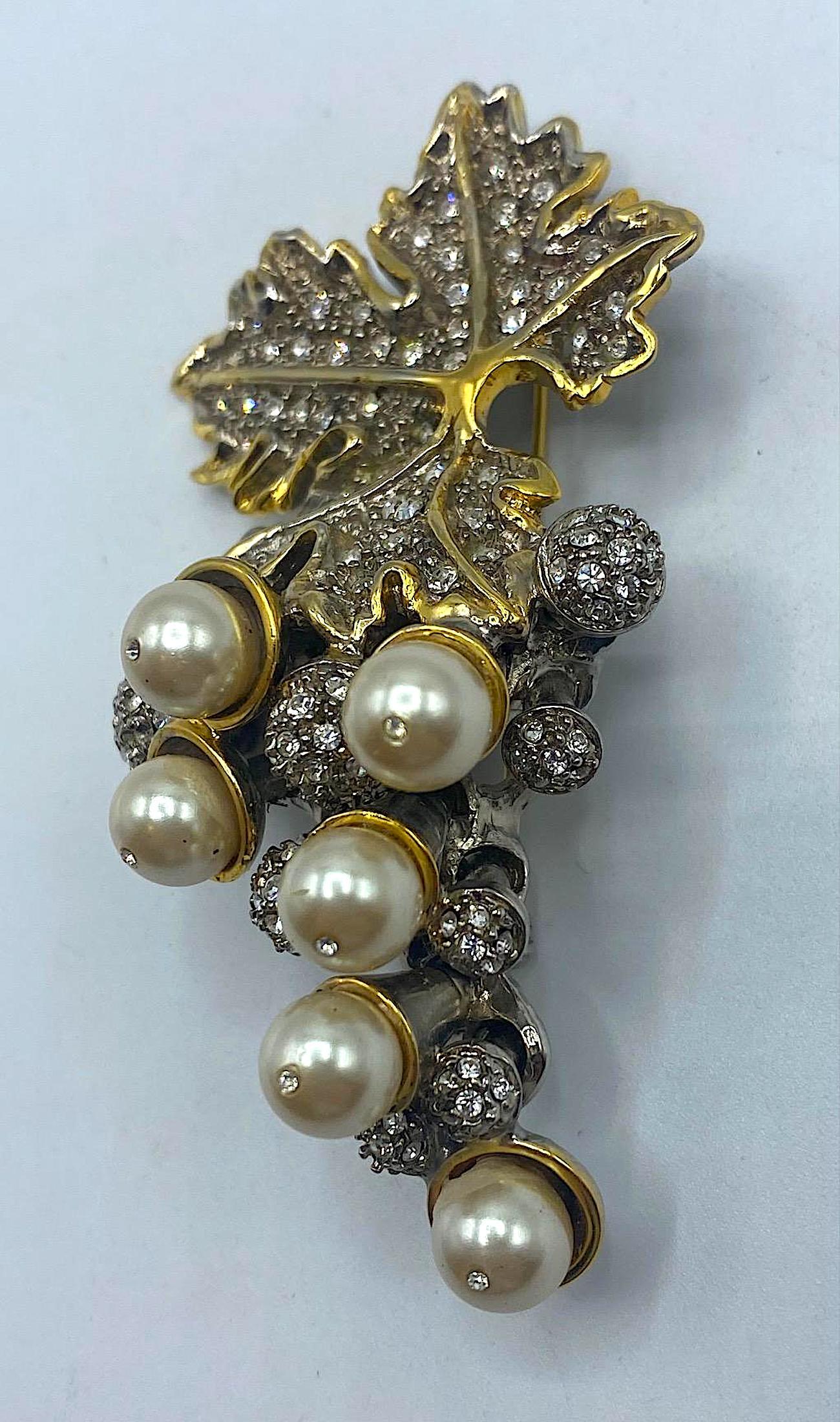 A beautifully made grape cluster brooch in faux pearl and pave' rhinestone by Italian fashion jewelry designer Gianni De Liguoro. The setting is meticulously designed and crafted to create a three dimensional design. The main part of the brooch is