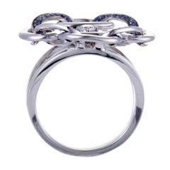 Anillo Gianni Lazzaro de oro blanco de 18 quilates con diamantes y zafiros calados con pavé
