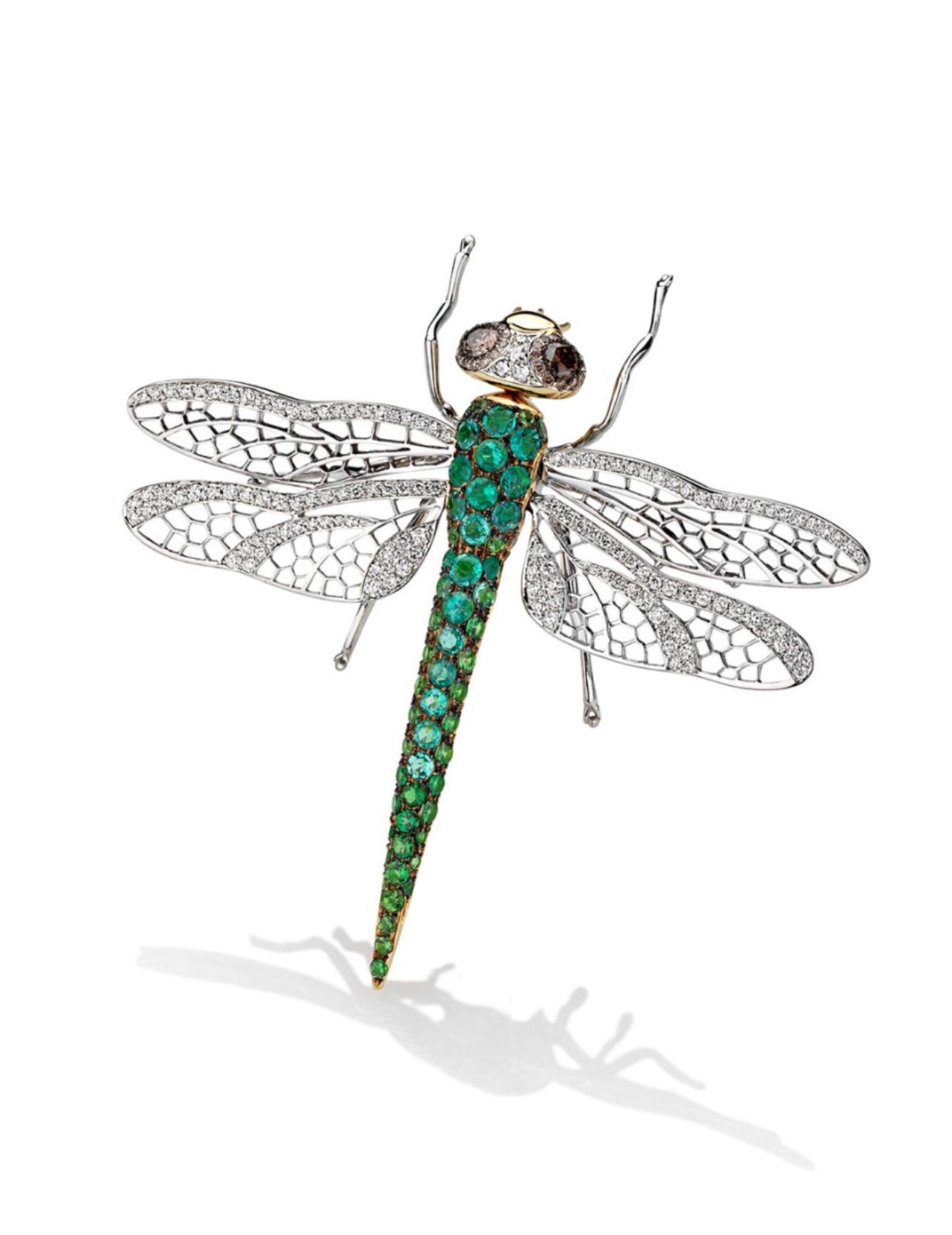 Brooch White Gold 18 K Gianni Lazzaro 

Diamonds 129-.1,74ct.Gvs
Diamond 2-0,40 ct
Emerald 49-10,12ct.

With a heritage of ancient fine Swiss jewelry traditions, NATKINA is a Geneva-based jewelry brand that creates modern jewelry masterpieces