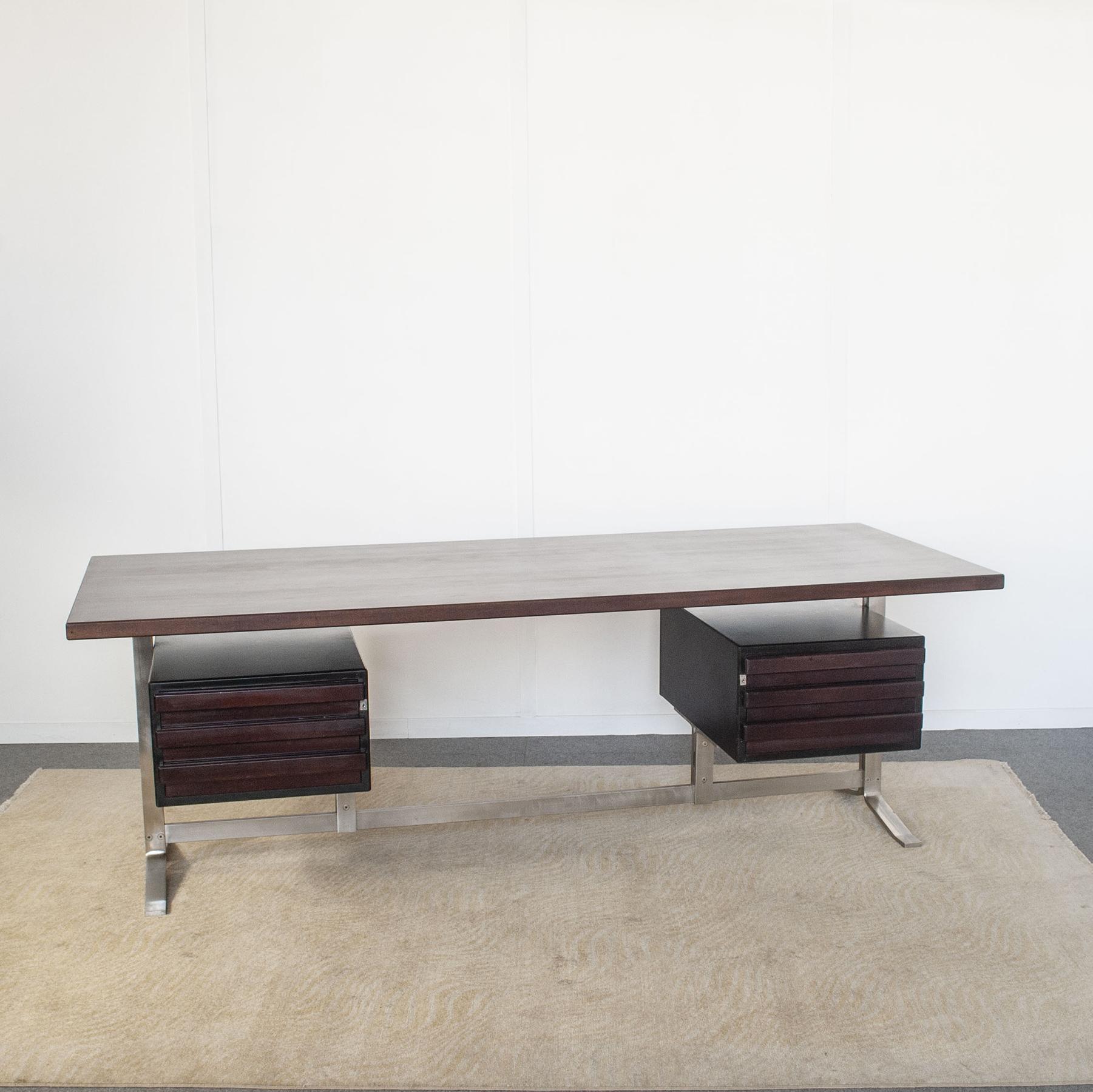 Desk design by Gianni Moscatelli for Formanova 1970s. Palisander desk surface rests on flat stainless steel legs with floating drawers on either side. Original locks without keys.