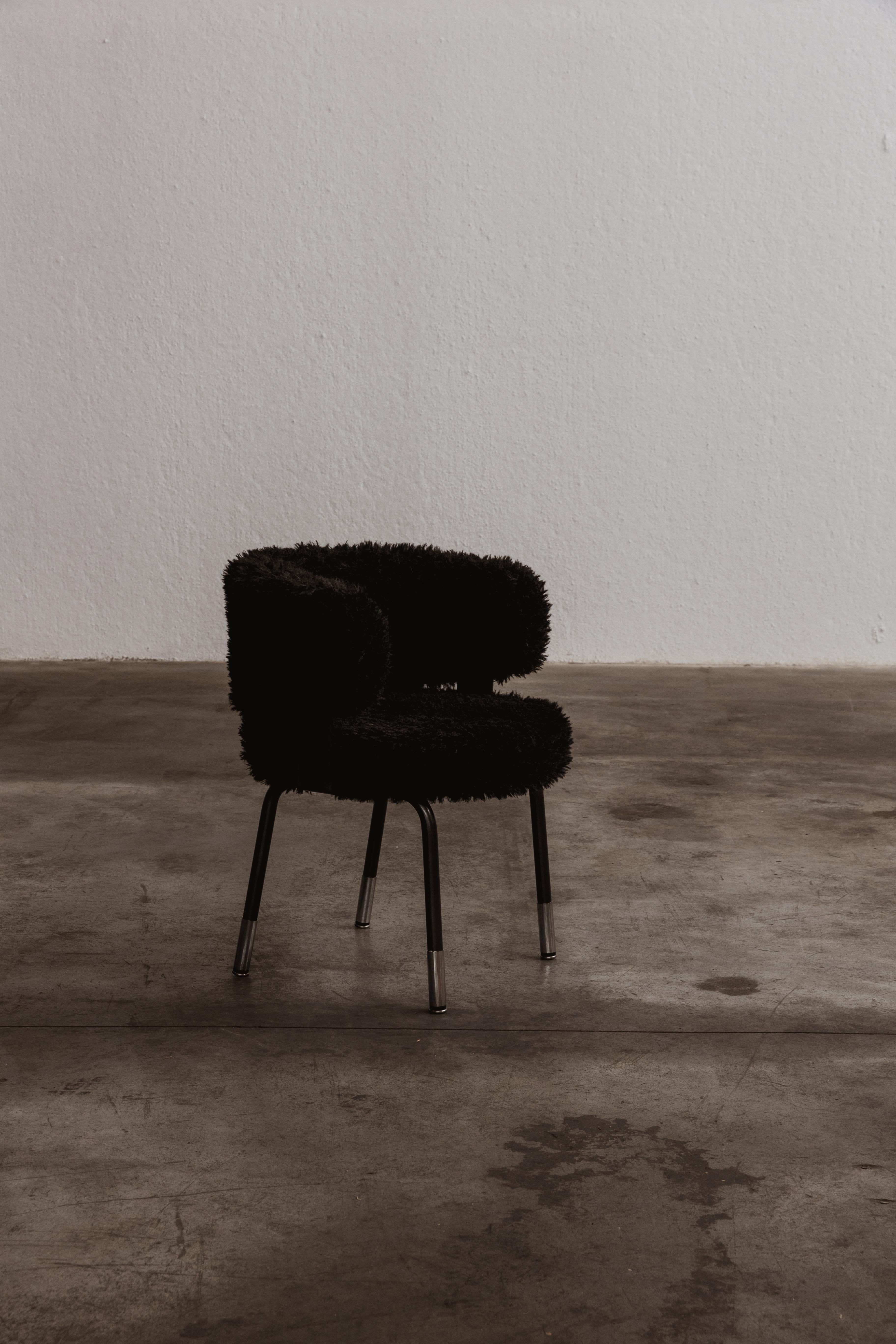 Gianni Moscatelli dining chairs for Formanova, black faux-fur and iron, Italy, 1968.

This chair represents timeless items designed by Gianni Moscatelli for Formanova in the 1960s. Its design features pure and functional lines, enhanced by some