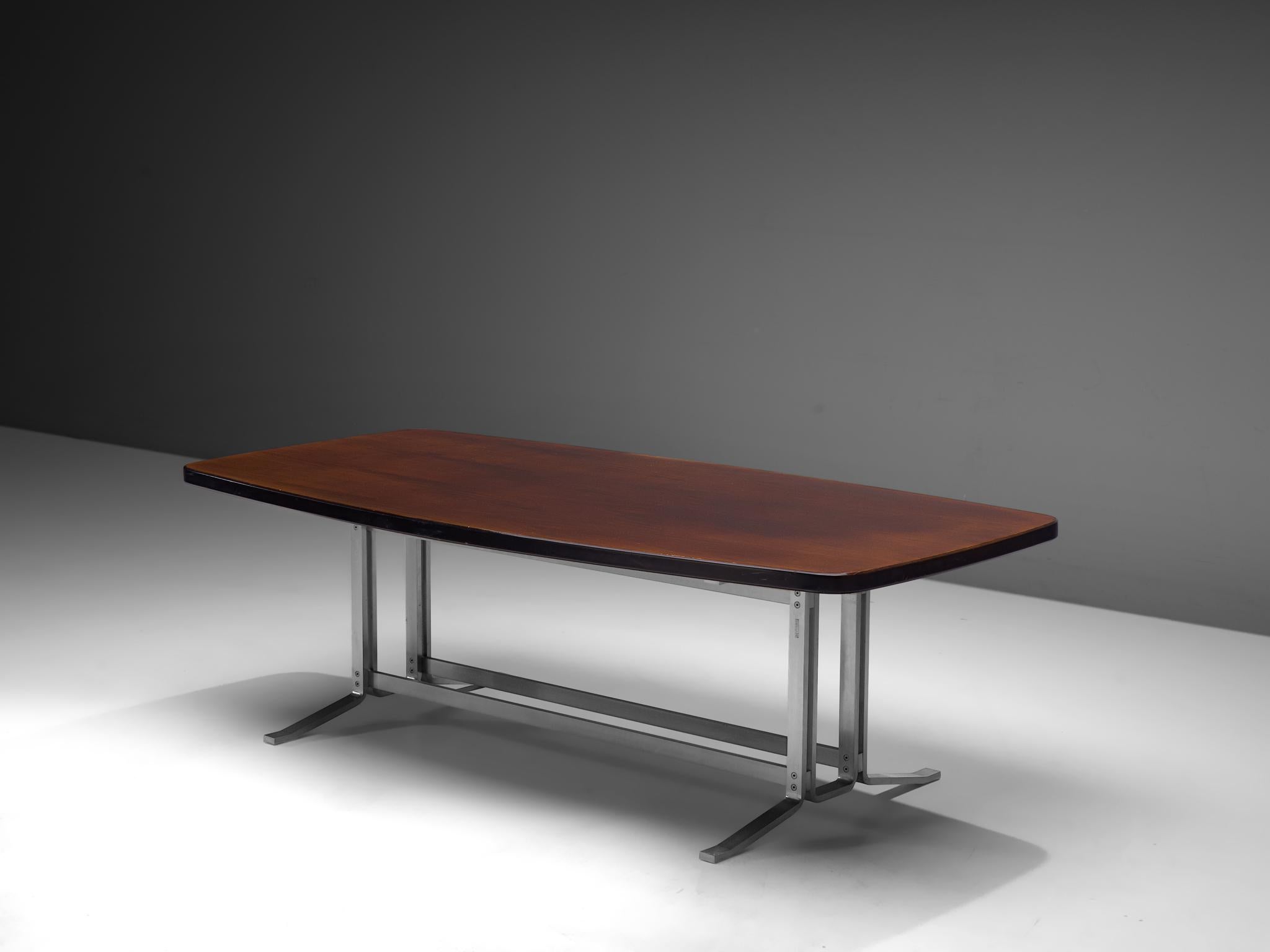 Gianni Moscatelli for Formanova, dining table, steel and mahogany, Italy, 1960s.

1960s Formanova table or desk by Gianni Moscatelli. The piece features a boat shaped table top, resting on a modest and architectural chromed frame. The lacquered wood