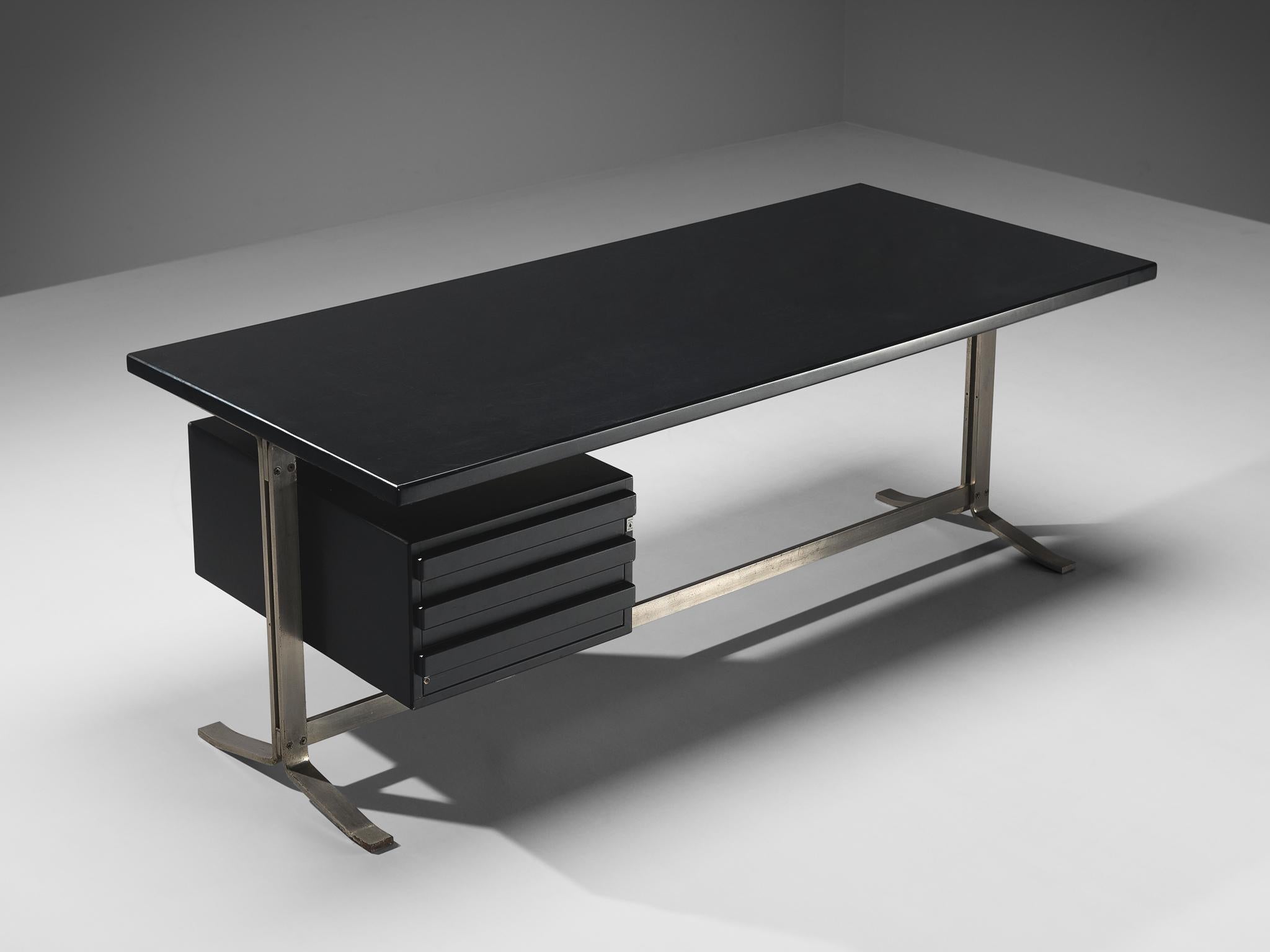 Gianni Moscatelli for Formanova, desk, black lacquered wood, nickel-plated steel, Italy, 1960s

This modern, streamlined writing desk is designed by Gianni Moscatelli in the sixties. Its notable feature is a spacious tabletop, firmly affixed to a