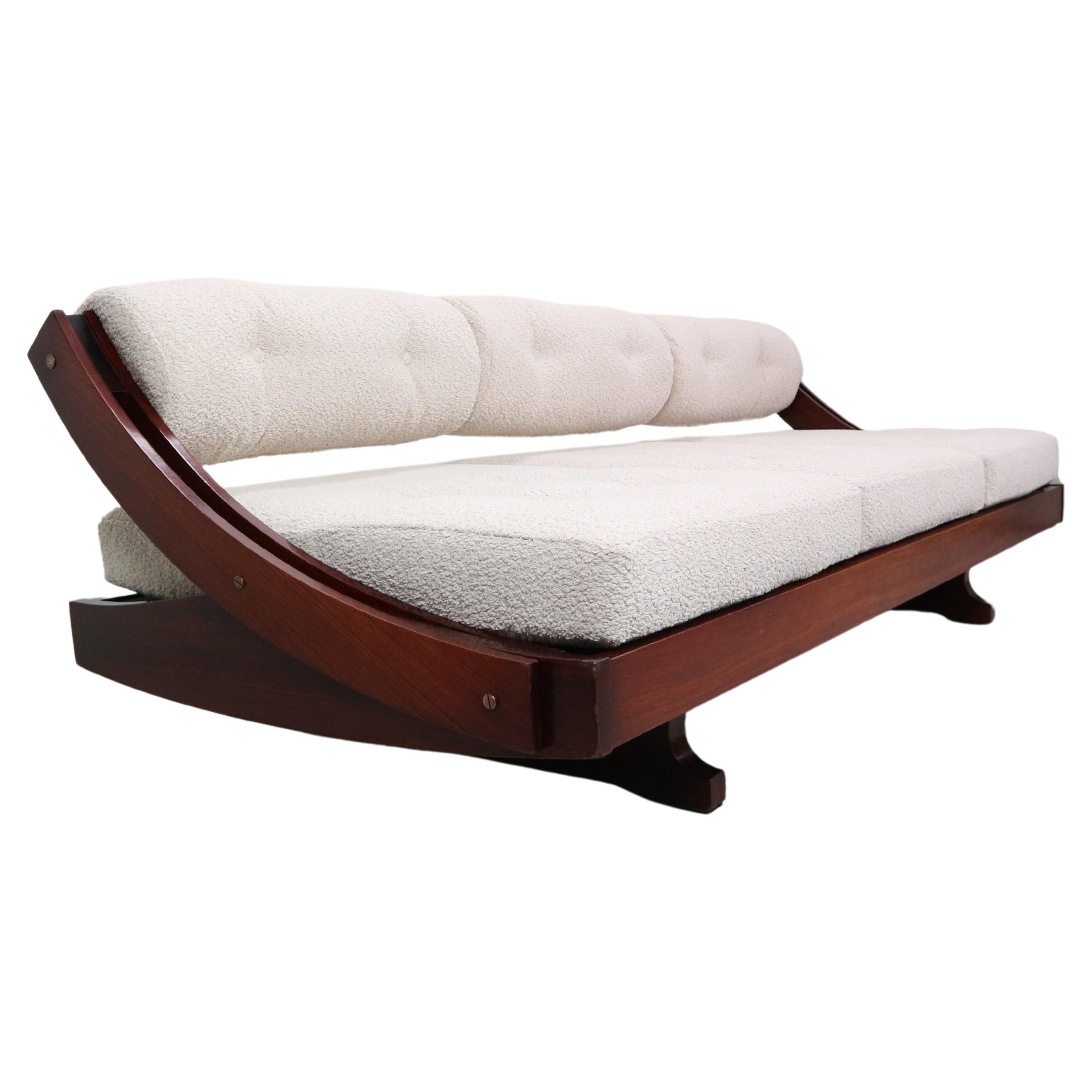 Beautiful GS-195 daybed sofa designed by Gianni Songia for Sormani, Italy, 1963. Very elegant and sculptural rosewood frame with a new off-white boucle upholstery. The back rest can be adjusted in two positions to use as a sofa or daybed and is