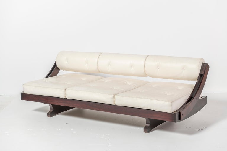 Known as the 'Gs-195' , this is an adjustable white leather daybed designed by Gianni Songia for Sormani circa 1967. This daybed sofa is made of white leather upholstered on a rosewood frame. The backrest adjusts to allow a deeper seat depth for