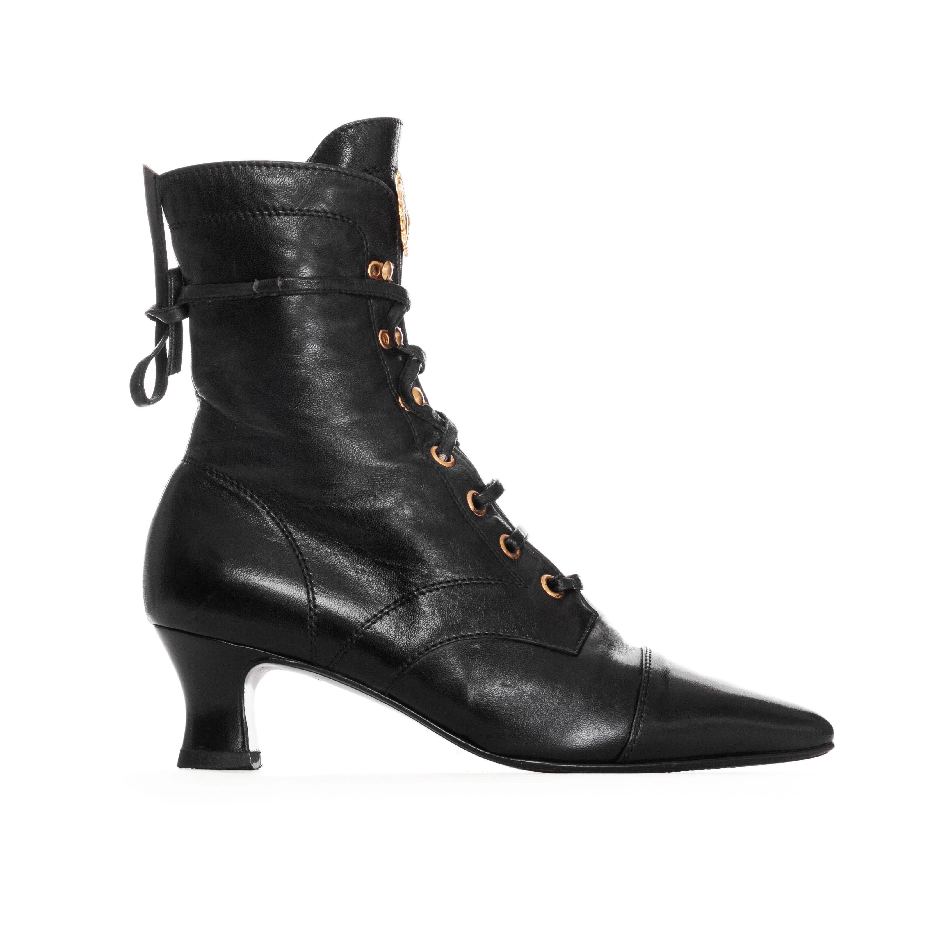 Gianni Versace 1980s Black Leather Gold-Tone Medusa Pointed Ankle Boots

Vintage; circa 1980s
Black
Gold-tone hardware
Pointed cap toe
Spool heel
Lace up closure with hooked eyelets at shaft 
Leather laces
Medusa logo on tongue
Made in Italy
Very