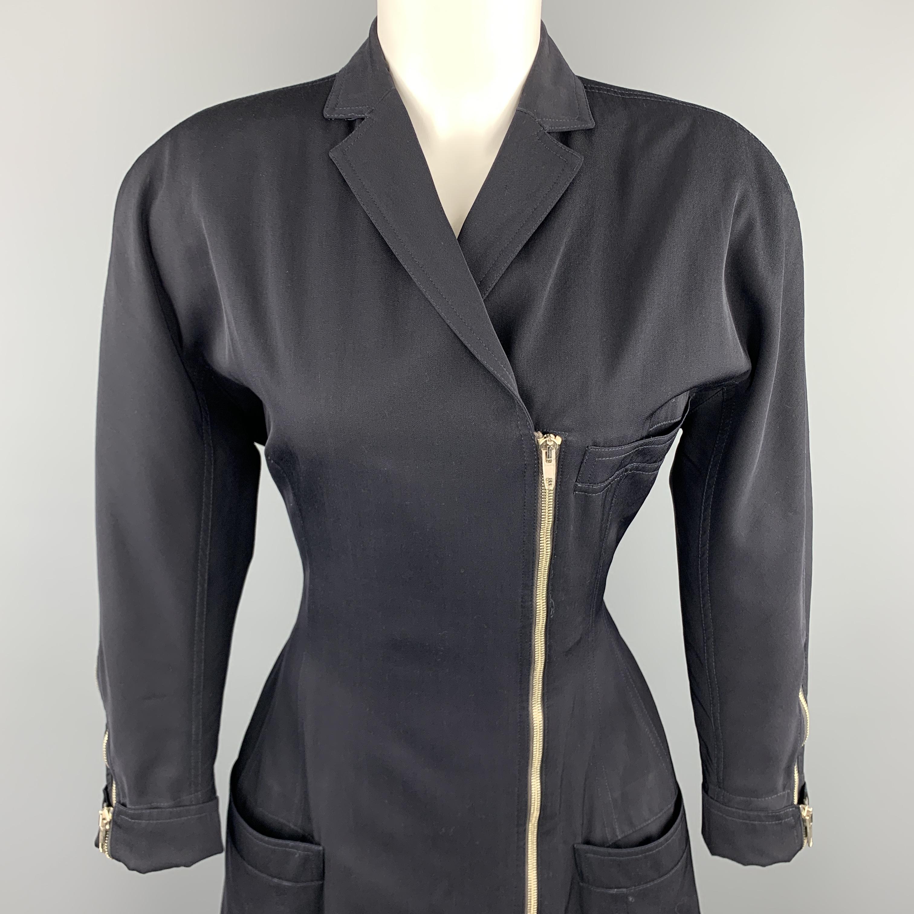 Vintage 1980's GIANNI VERSACE dress blazer dress comes in navy wool cotton blend twill with padded shoulders, notch lapel, asymmetrical zip closure, batwig sleeves with zip cuffs, tailored cinched waist, and hip pockets. Made in Italy.

Excellent