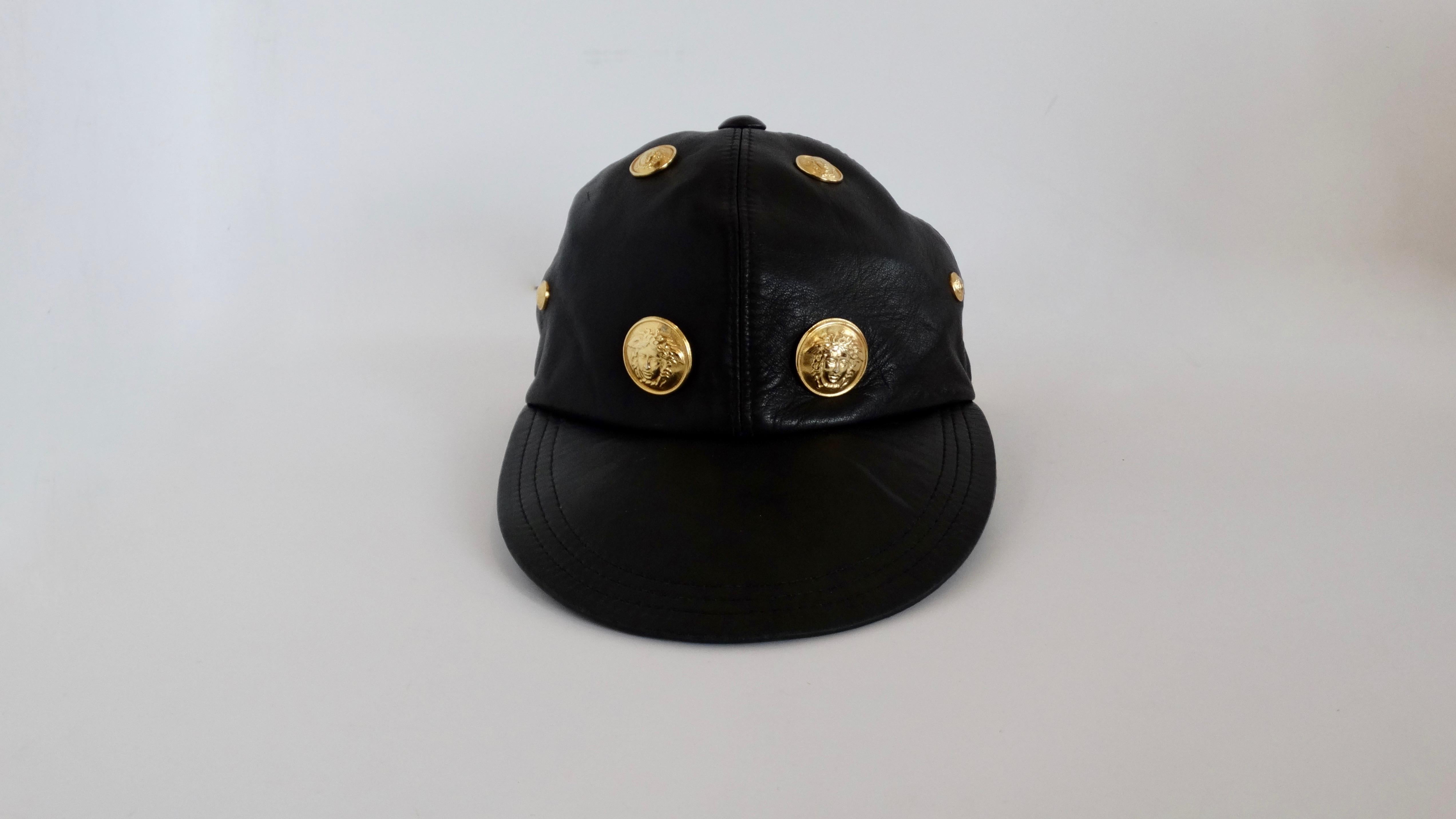 Add a touch of 90s Versace to your look with this amazing Gianni Versace hat! Circa early 1990s, this hat is crafted from ultra soft black leather and features a flat bill. Cap is adorned with various sizes of gold Medusa heads. Perfect to throw on