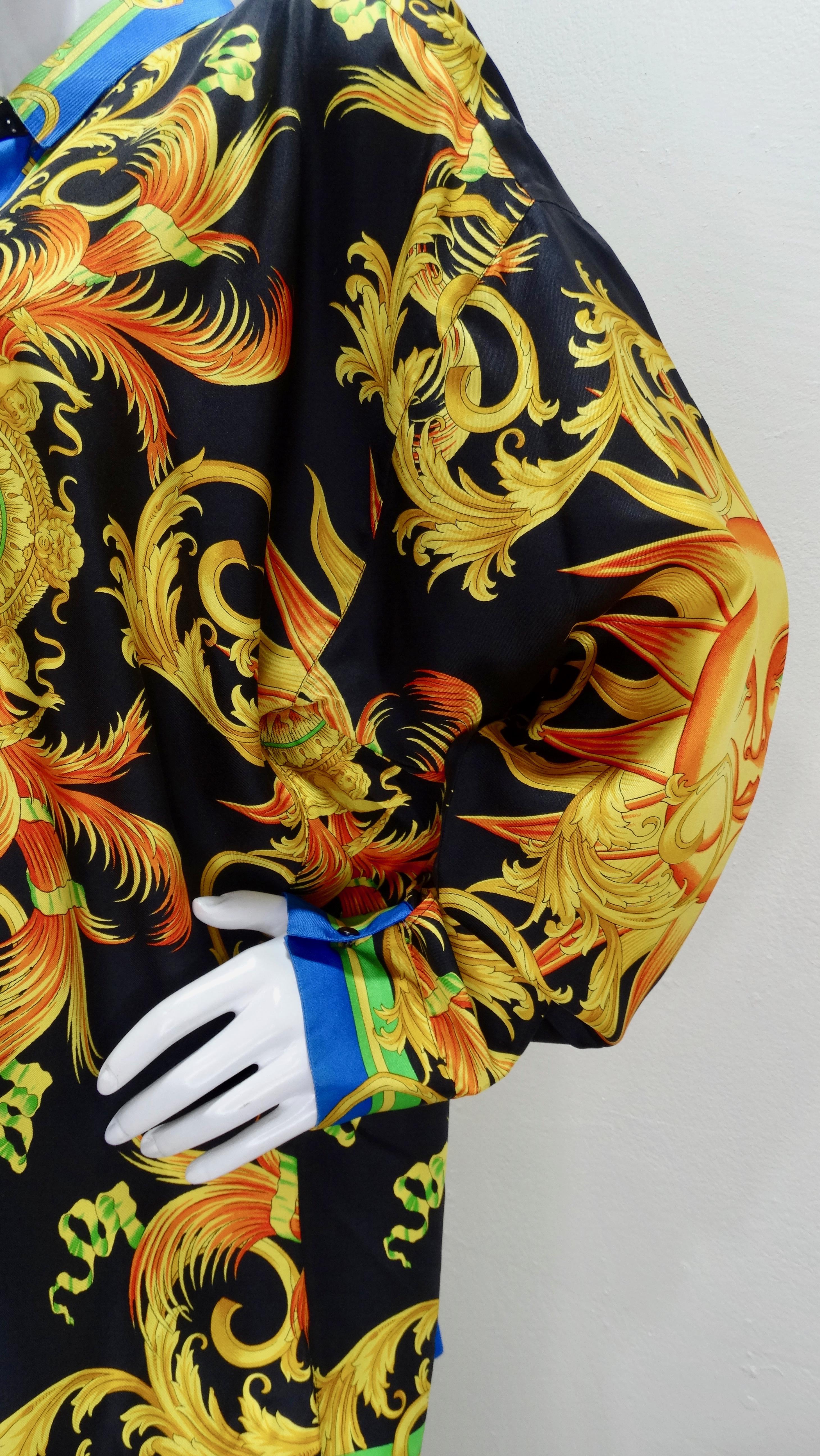 Snag yourself a piece from the Versace archives! Circa 1990s, this colorful Silk button down shirt features a vibrant Celestial sun motif mixed with Versace's signature Baroque designs. Front displays smaller suns with Roman inspired statues and a