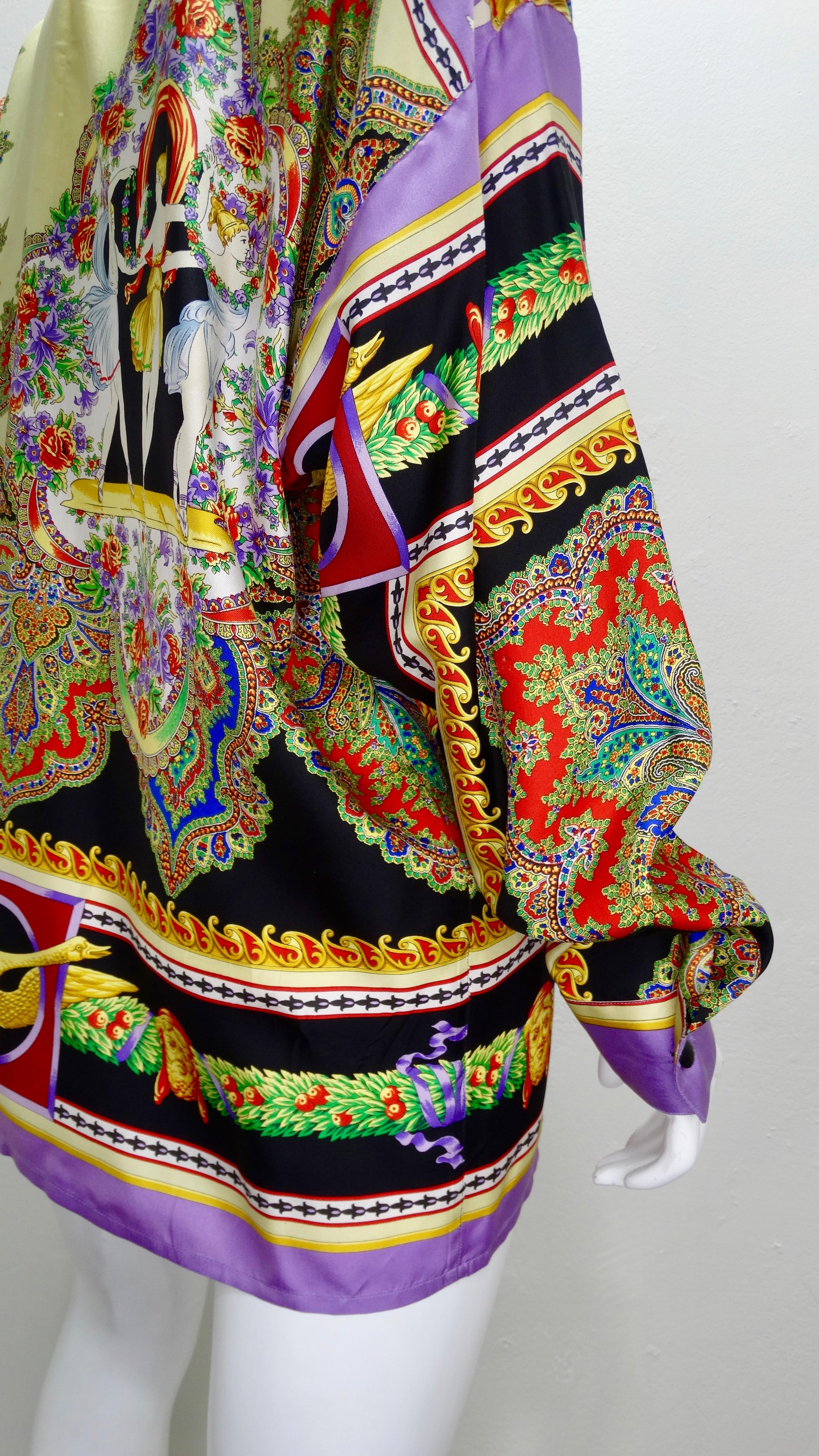 Snag yourself a piece from the Versace archives! Circa 1990s, this Silk button down shirt features a vibrant motif detailing ancient Greek theater. Colorful and intricate, the motif features paisley and floral designs, ancient Greek busts, ancient