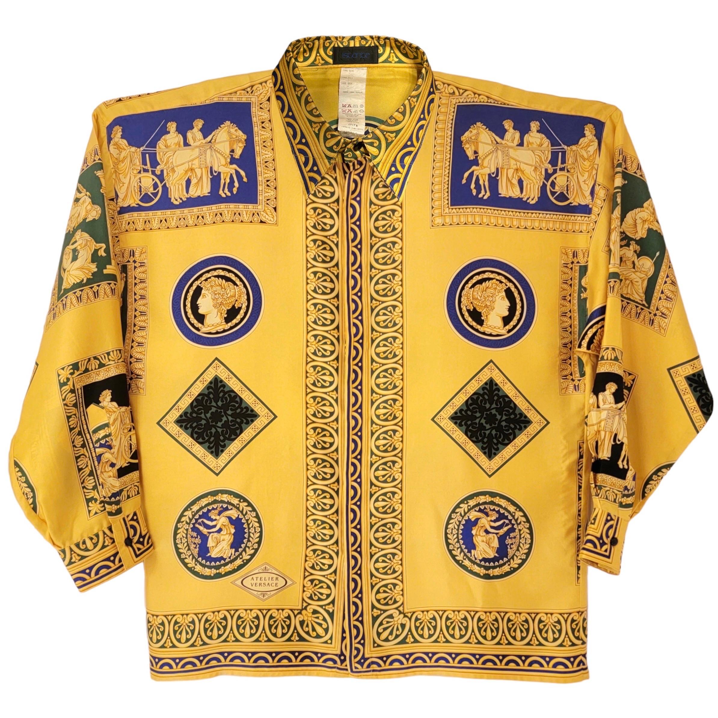 Gianni Versace Atelier labeled Istante line Silk Shirt from 1992.

This shirt shows framed greek gods/goddesses in mythology motifs with chariots and greek key patterns throughout.

Condition: Excellent.

Size: IT 48, a Men’s US size Medium, This