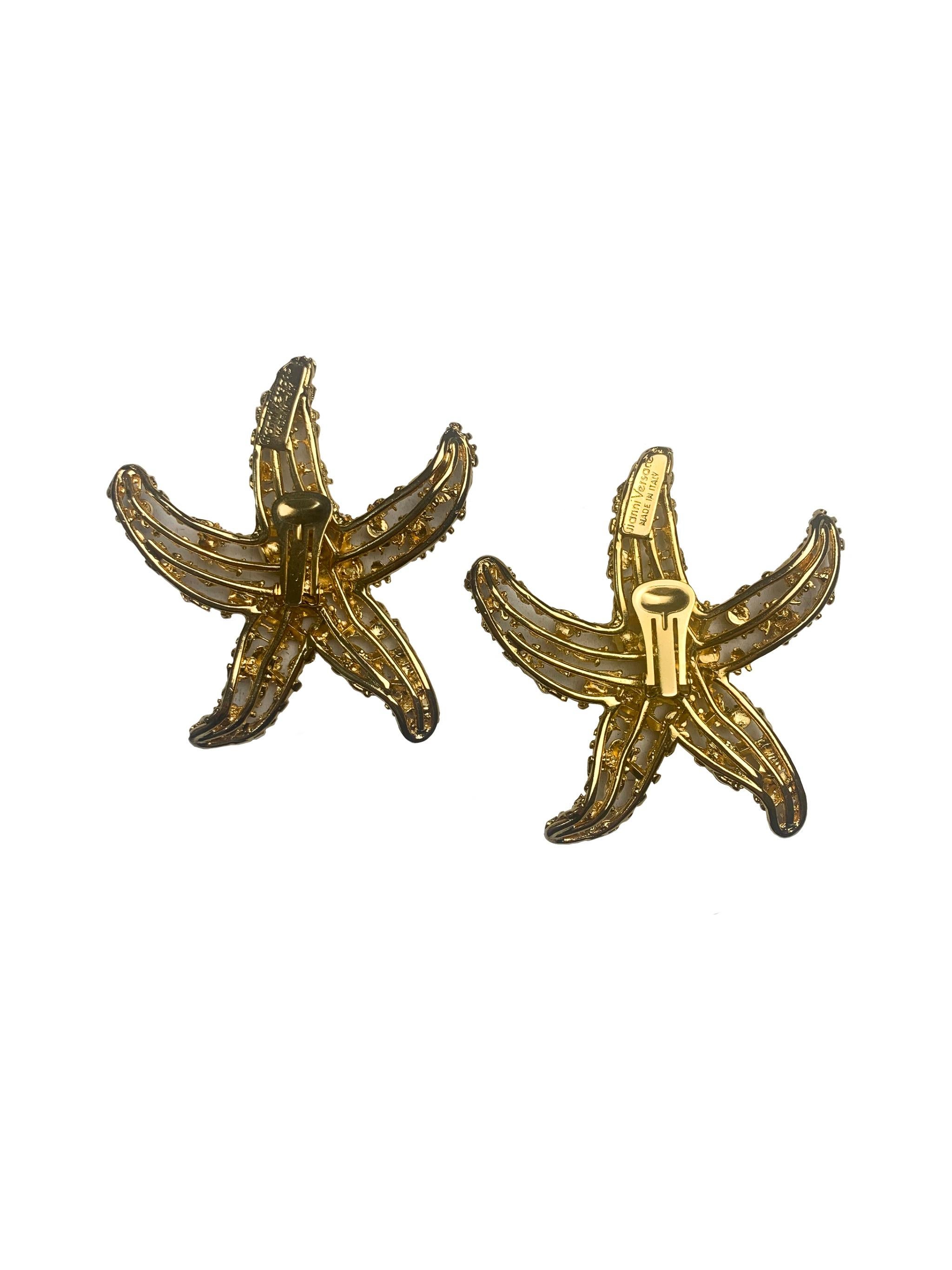 These Gianni Versace 1992 starfish earrings are from the Spring Summer 1992 collection. Heavily inspired by an underwater theme Versace the gold tone earrings feature a cutout starfish design. Carved and crafted the earrings also feature intricate
