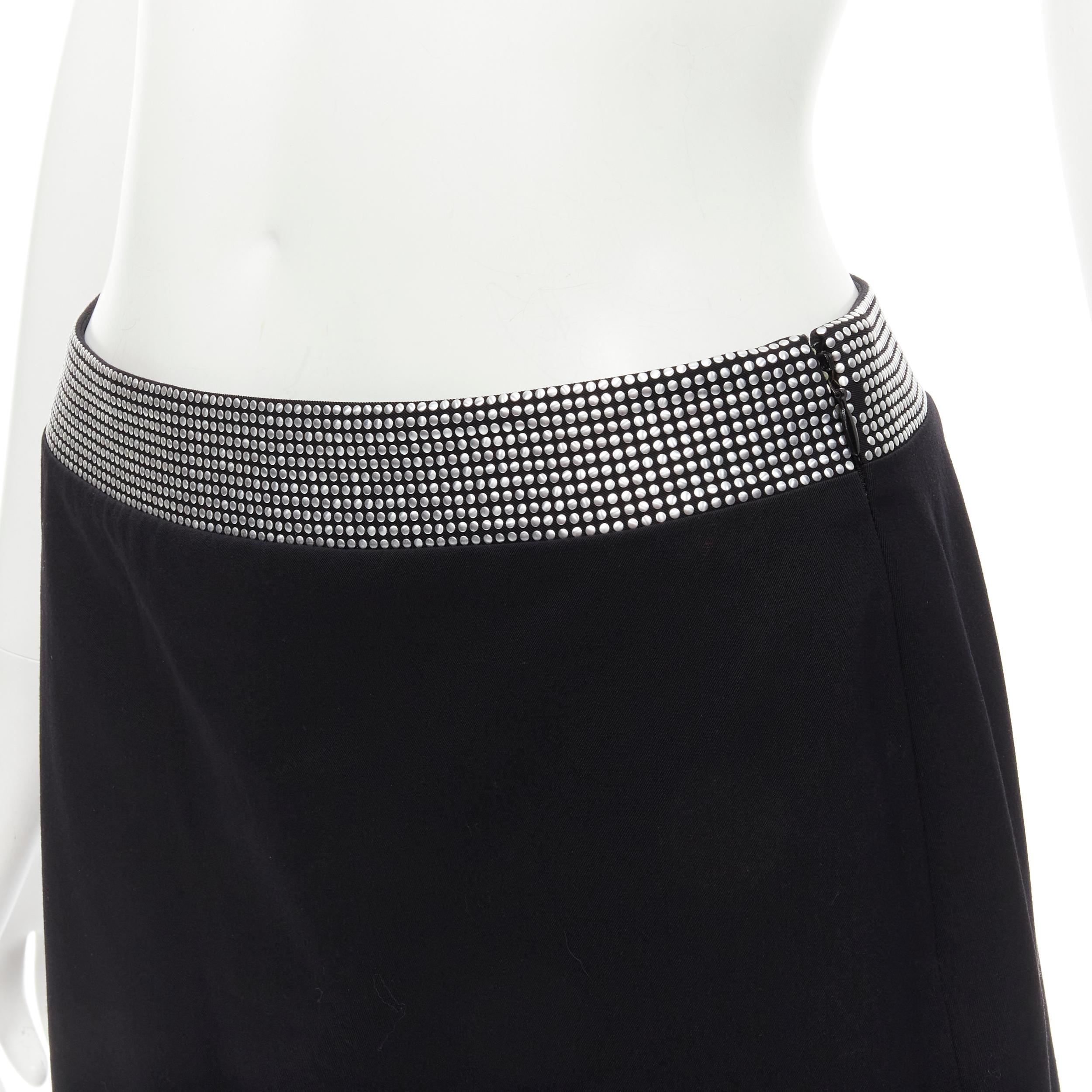 GIANNI VERSACE 1998 Vintage silver stud embellished waist wool skirt IT40 XS 
Reference: GIYG/A00138 
Brand: Gianni Versace 
Collection: 1998 
Material: Wool 
Color: Black 
Pattern: Solid 
Closure: Zip 
Extra Detail: Silver studded waist. 
Made in: