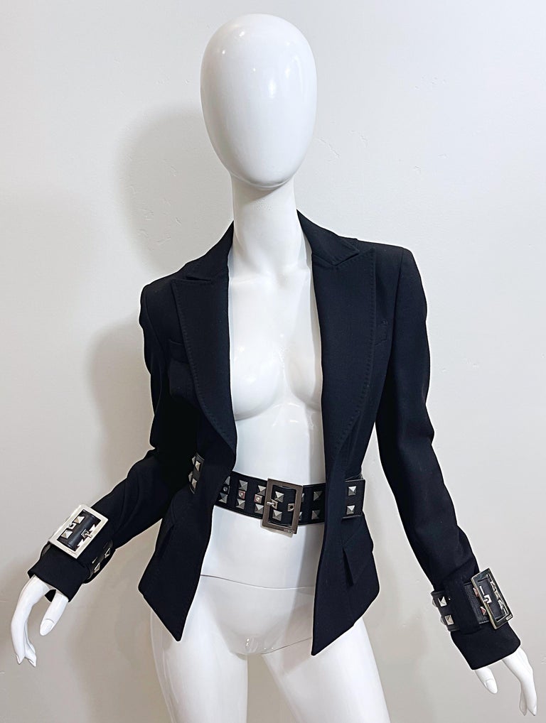 Sexy early 2000s GIANNI VERSACE black bondage inspired belted tailored blazer ! Features a wide studded belt that loops through the jacket. Large silver belt buckles with adjustable options. Great alone or tailored. In perfect condition
Made in
