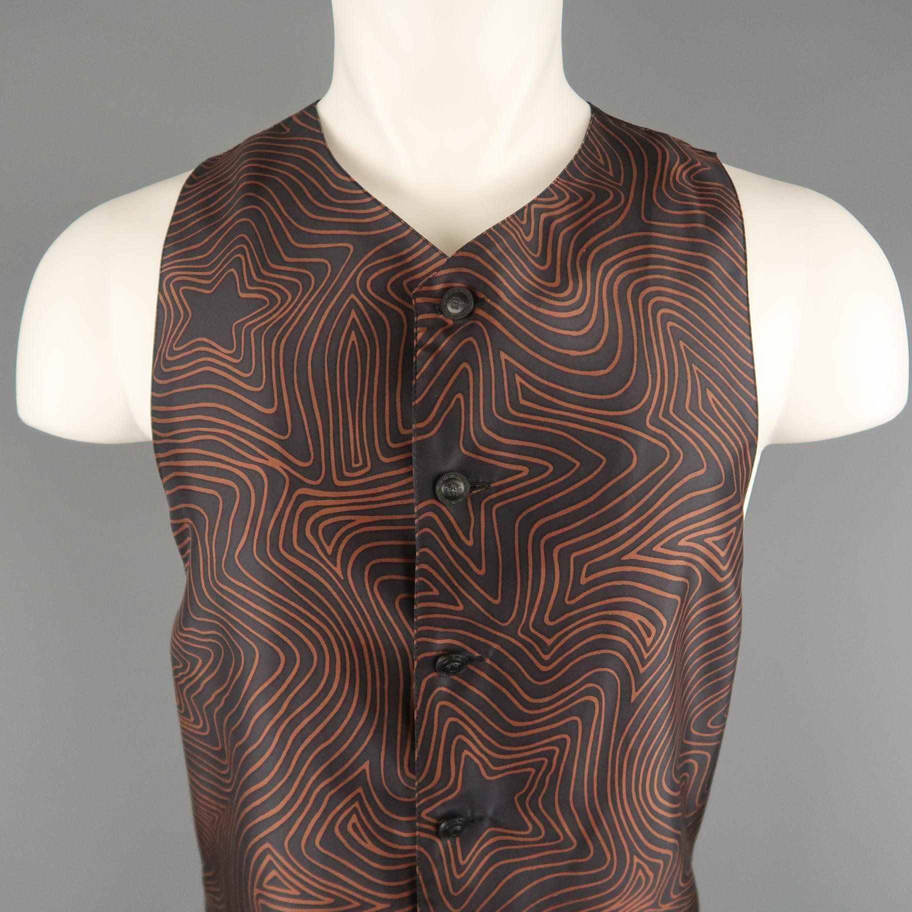 Vintage 1990's GIANNI VERSACE vest comes in black and brown star print silk with a high V neck, black Medusa button front, and silver tone western hardware belt. Made in Italy.
 
Excellent Pre-Owned Condition.
Marked: IT 46
 
Measurements:
