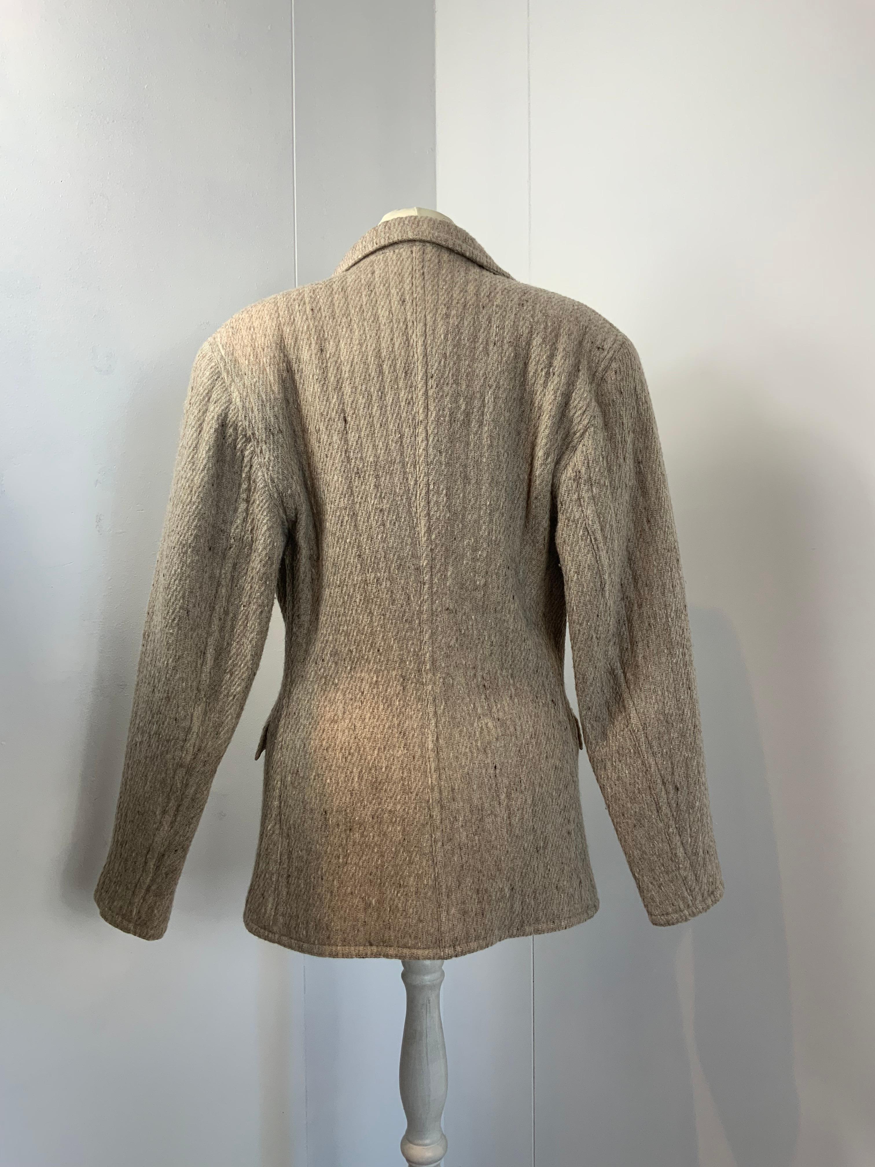 Gianni Versace vintage Jacket. 
Fabric is a mix between wool, alpaca and polyamid.
Featuring a V line neck, four front pockets and padded shoulders.
Size 38 Italian. But it fits bigger.
Measurements:
Shoulders 47 cm
Bust 42 cm
Sleeves 60 cm
Length