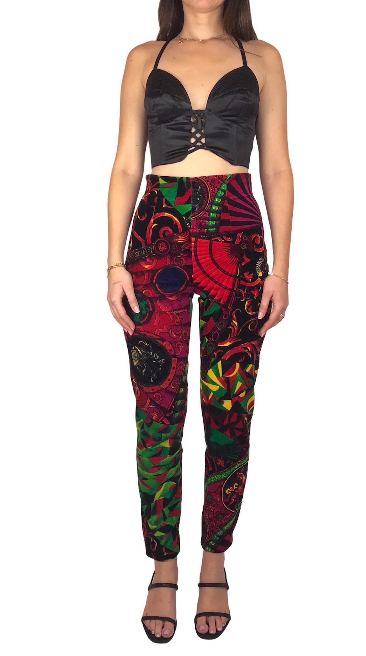 GIANNI VERSACE, Made in Italy, circa 89.
Vibrant multicolored abstract baroque velvet leggings. High waist with zipper on the side. 
Tag size is 42IT. Model is a 36EU and it fits perfeclty.
Please see measurements bellow, taken flat and unstretched