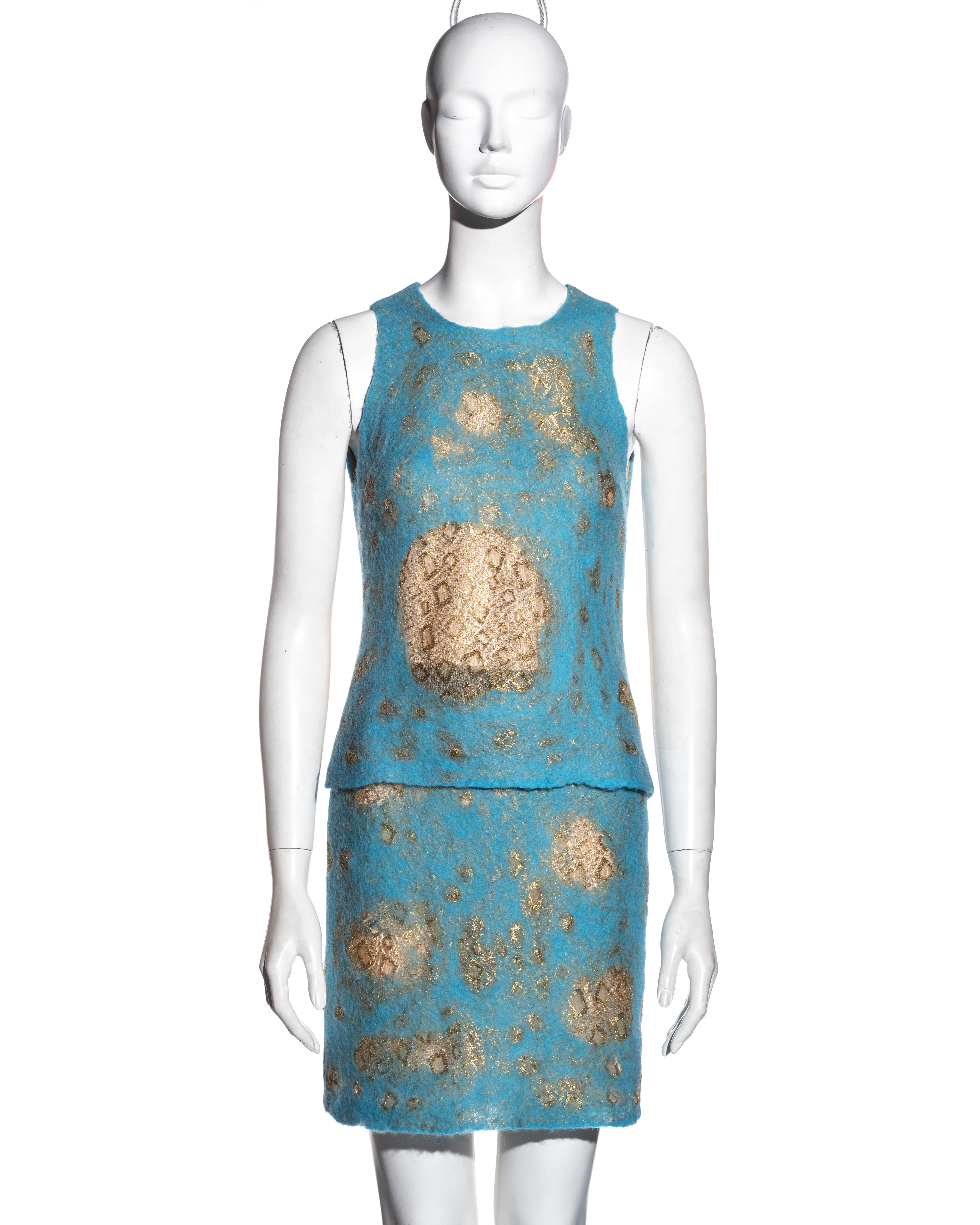 ▪ Gianni Versace aqua blue felted wool top and skirt set
▪ Designed by Donatella Versace
▪ Felted wool with metallic gold lace underlay 
▪ Nude mesh lining with crystals 
▪ Fitted sleeveless top 
▪ High waisted mini skirt 
▪ IT 38 - FR 34 - UK 6 -