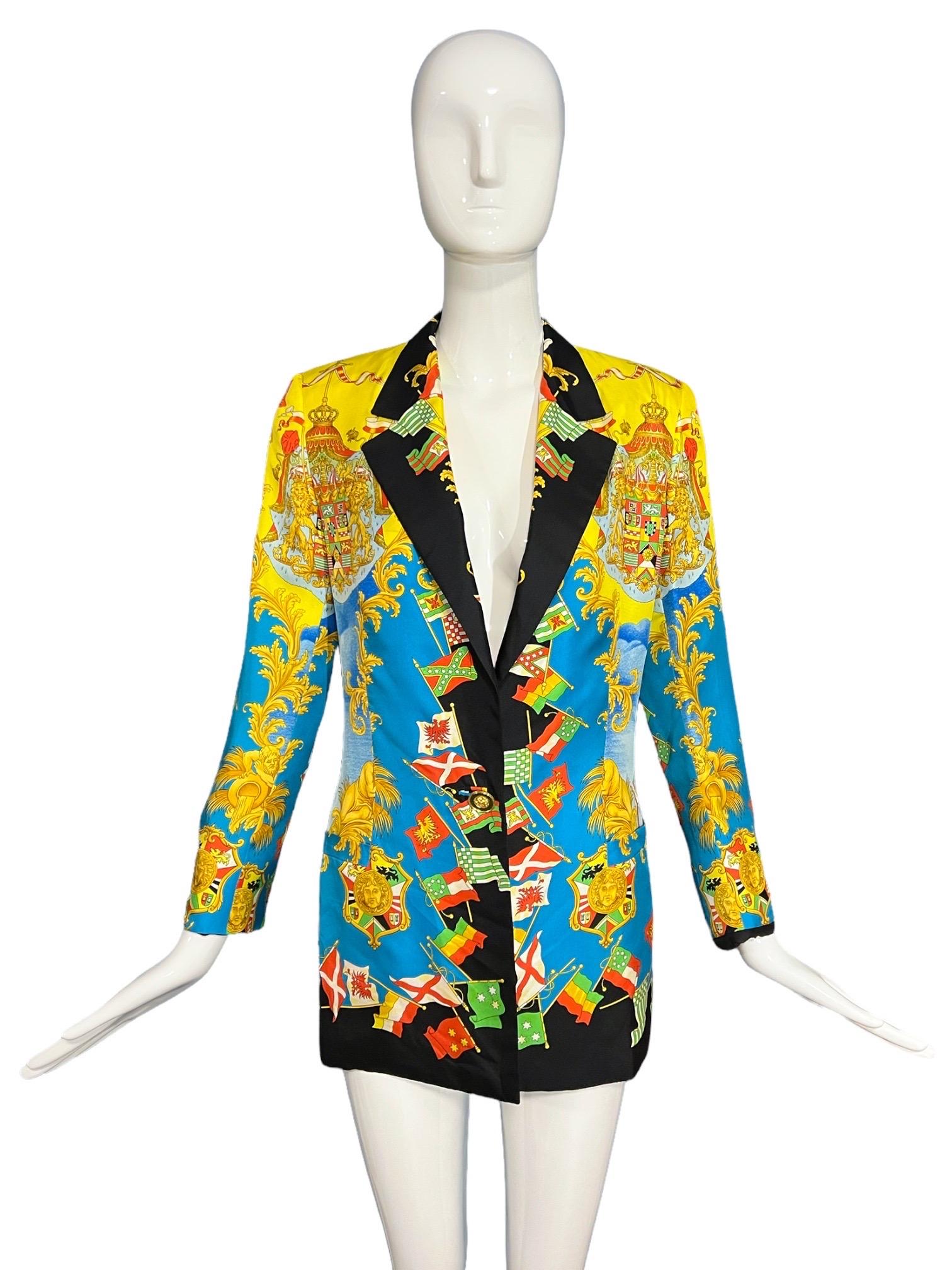 Gianni Versace Vintage 1993 Flag Silk Blazer themed around the Italian Explorer Amerigo Vespucci who helped discover America.

Featuring the Flags print from Spring Summer 1993 depicting Baroque multi colored flags, crowned lions, along with the