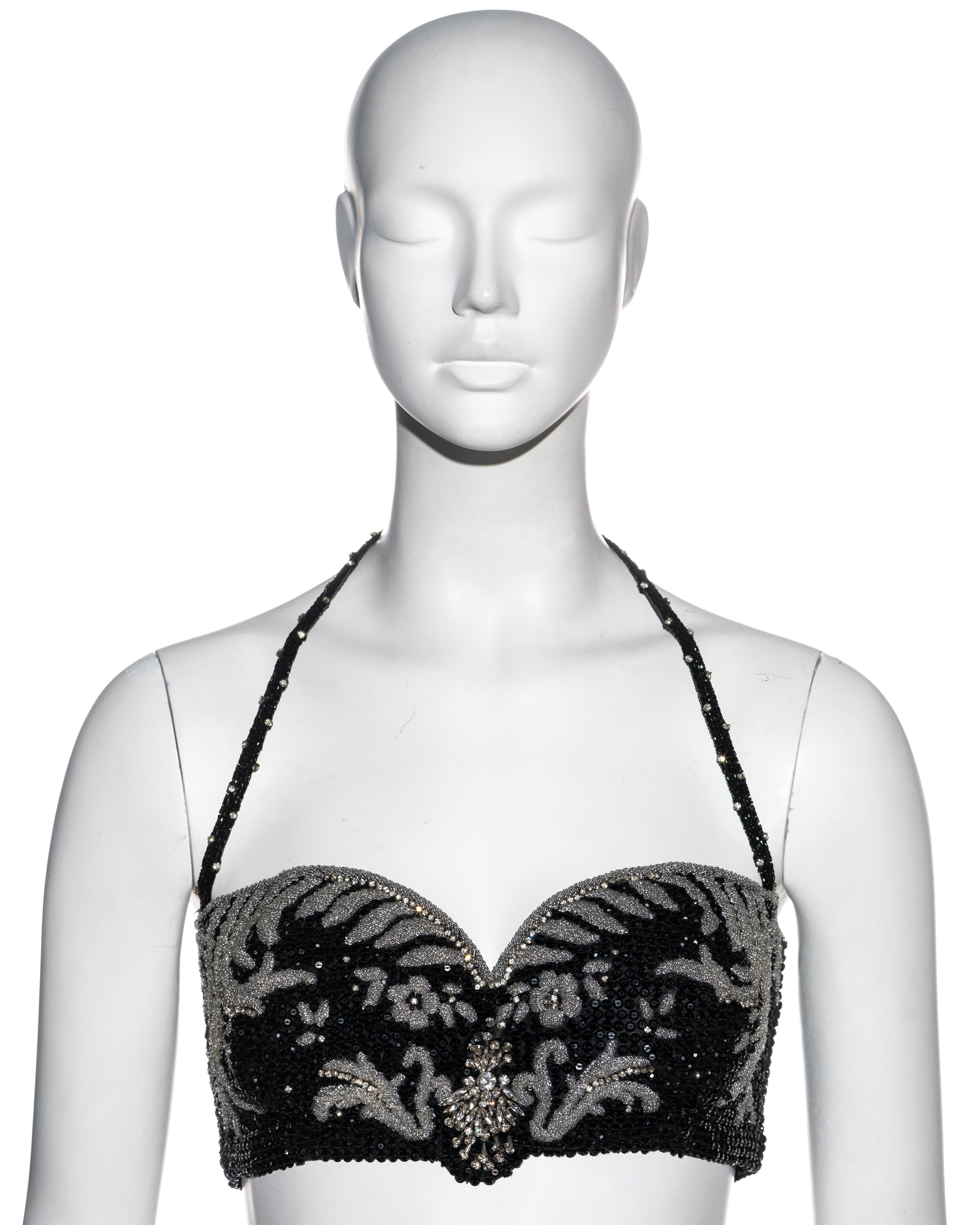 ▪ Gianni Versace silk corset bra 
▪ Fully beaded with black and clear beads 
▪ Crystal embellishment 
▪ Halterneck 
▪ Hook fastenings at centre back 
▪ IT 42 - FR 38 - UK 10 - US 6
▪ Fall-Winter 1989
