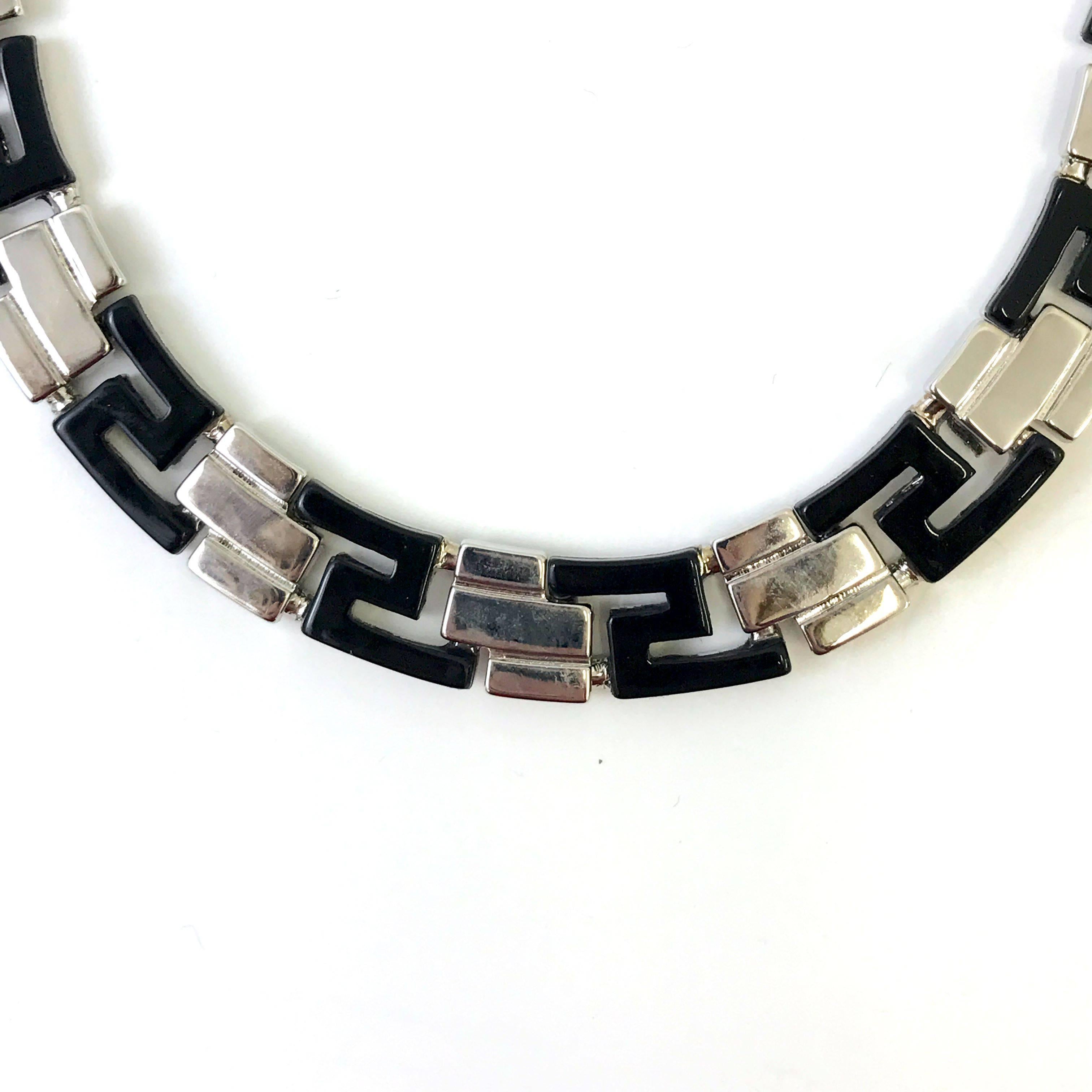If you are looking for a understated Gianni Versace item to add or to start your collection then this vintage Gianni Versace necklace is just the piece. The necklace features an alternate black and silver greek pattern which was used a lot by the