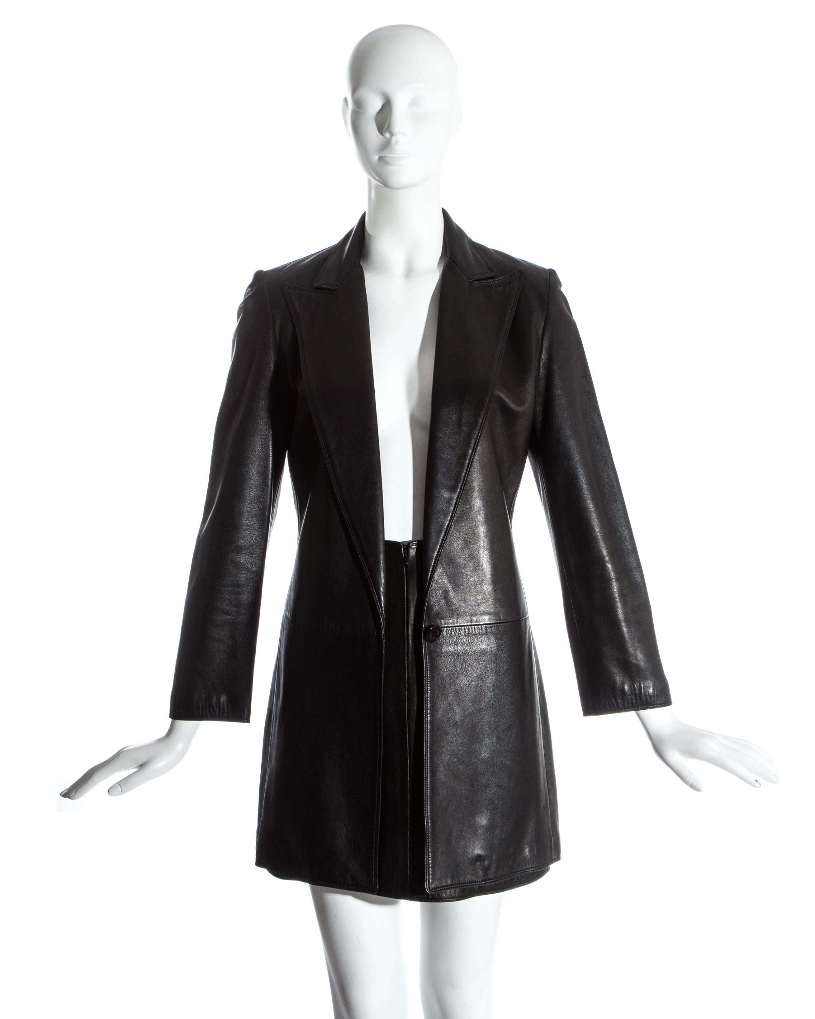 Gianni Versace, black lambskin leather skirt suit. Long blazer jacket with hidden 1 button closure. Matching mini skirt. 

Fall-Winter 1997