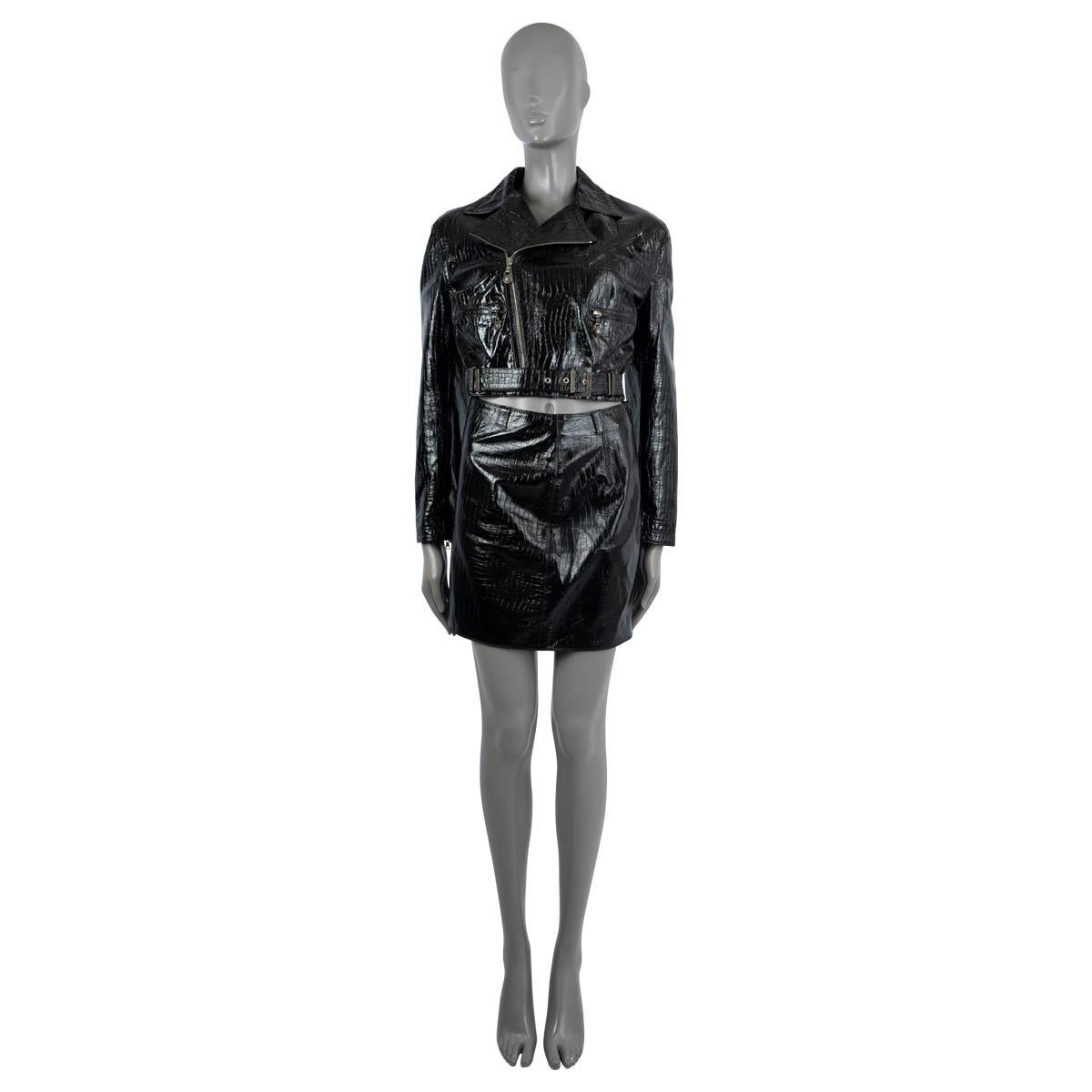 100% authentic Gianni Versace biker mini skirt suit in black crocodile embossed shiny leather. The jacket features three zip pockets on the front, a waist belt and closes with an asymmetric zipper. Lined in rayon. The mini skirt closes with a zipper