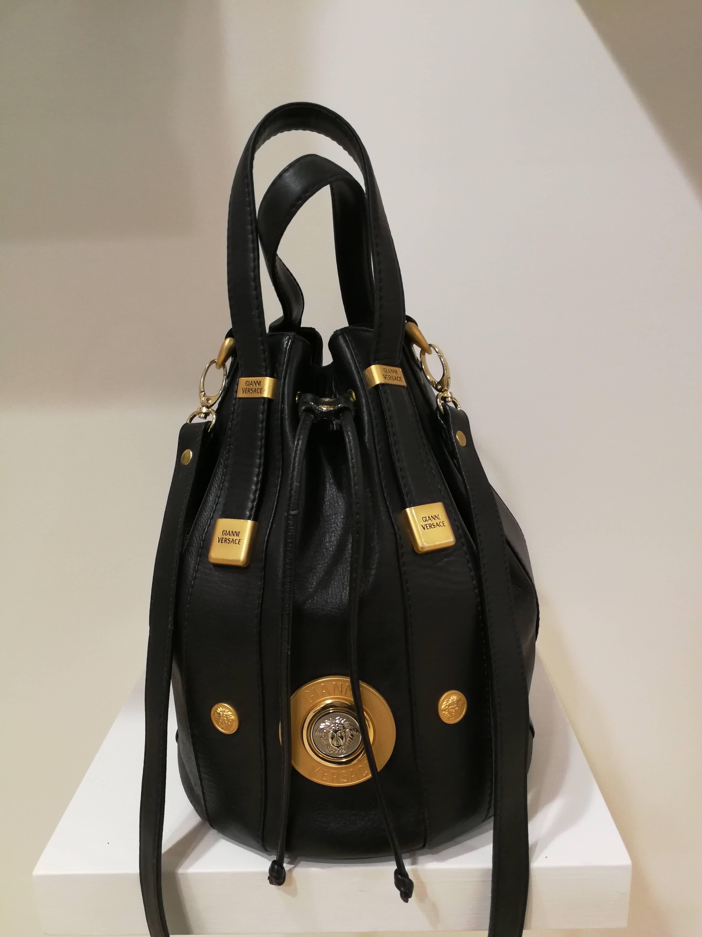 Gianni Versace Black leather Gold and Silver Tone Studs Satchel - Shoulder Bag

Unique Satchel from the 1990s
Can be used as a crossbody shoulder bag too as it comes with shoulder strap too
Gold silver tone medusa on the front
Totally made in italy 