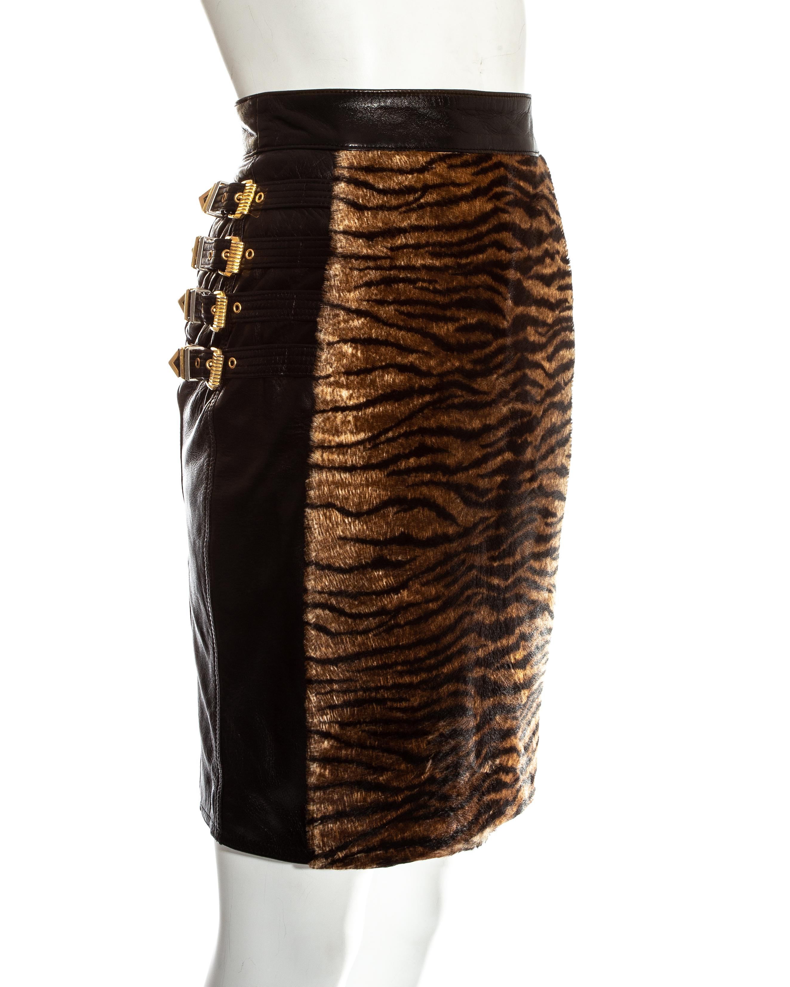 Women's Gianni Versace black leather gold buckled skirt with animal print, fw 1994 For Sale