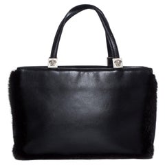 Gianni Versace, black leather handbag with fur