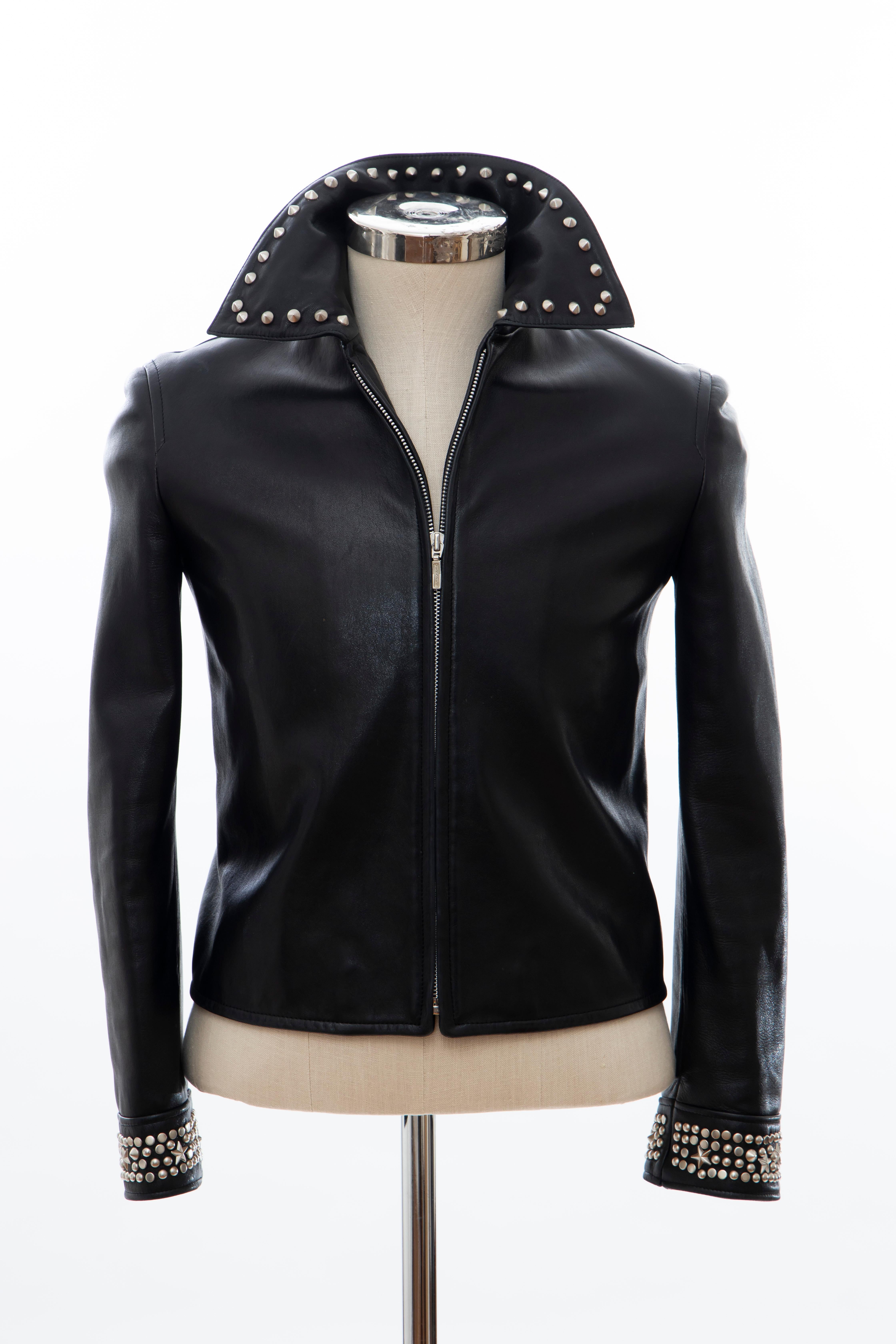 Gianni Versace, circa 1990's, black leather jacket with pewter stud embellishments at collar and cuffs, dual straps at back hem, front zip closure and fully lined.

IT. 40
US. 4

Bust 35”, Waist 32”, Shoulder 16”, Length 20.5”, Sleeve 22.5”
Fabric