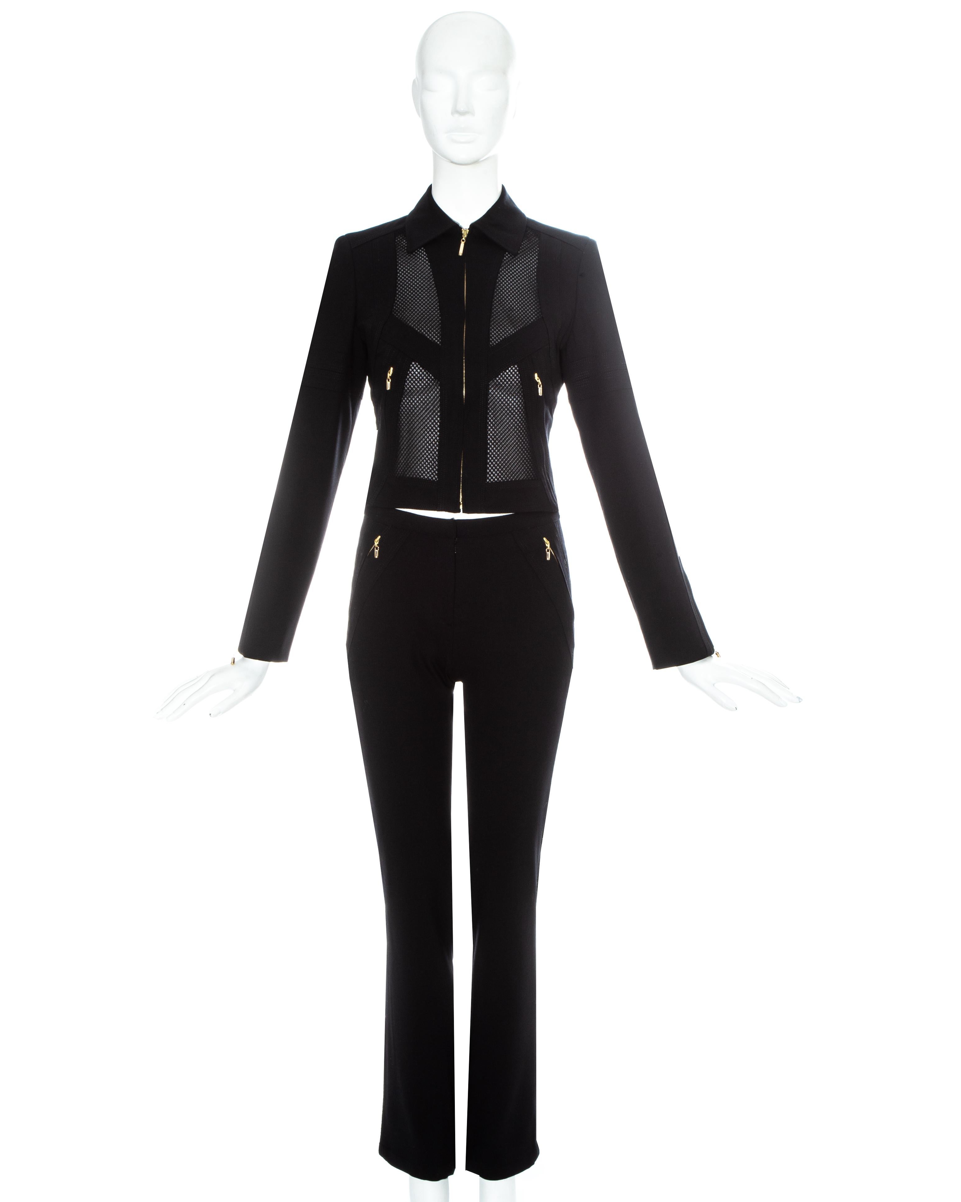 Gianni Versace - Combinaison pantalon en lycra et maille noire avec fermetures à glissière en métal doré

Printemps-été 20033