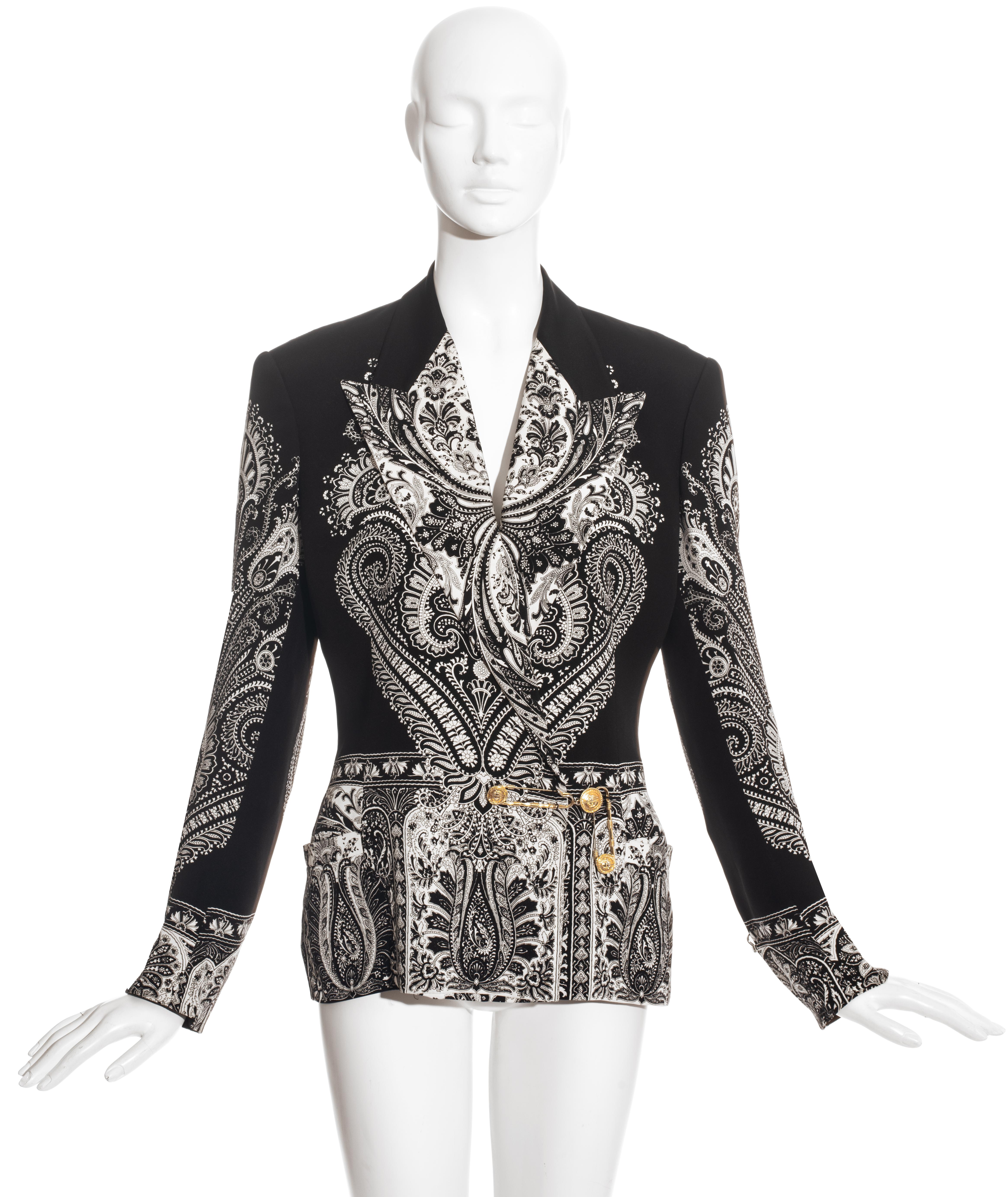 Gianni Versace black paisley printed silk blazer jacket with two gold safety-pin front closures and two silver safety-pins on the cuffs.

Spring-Summer 1994