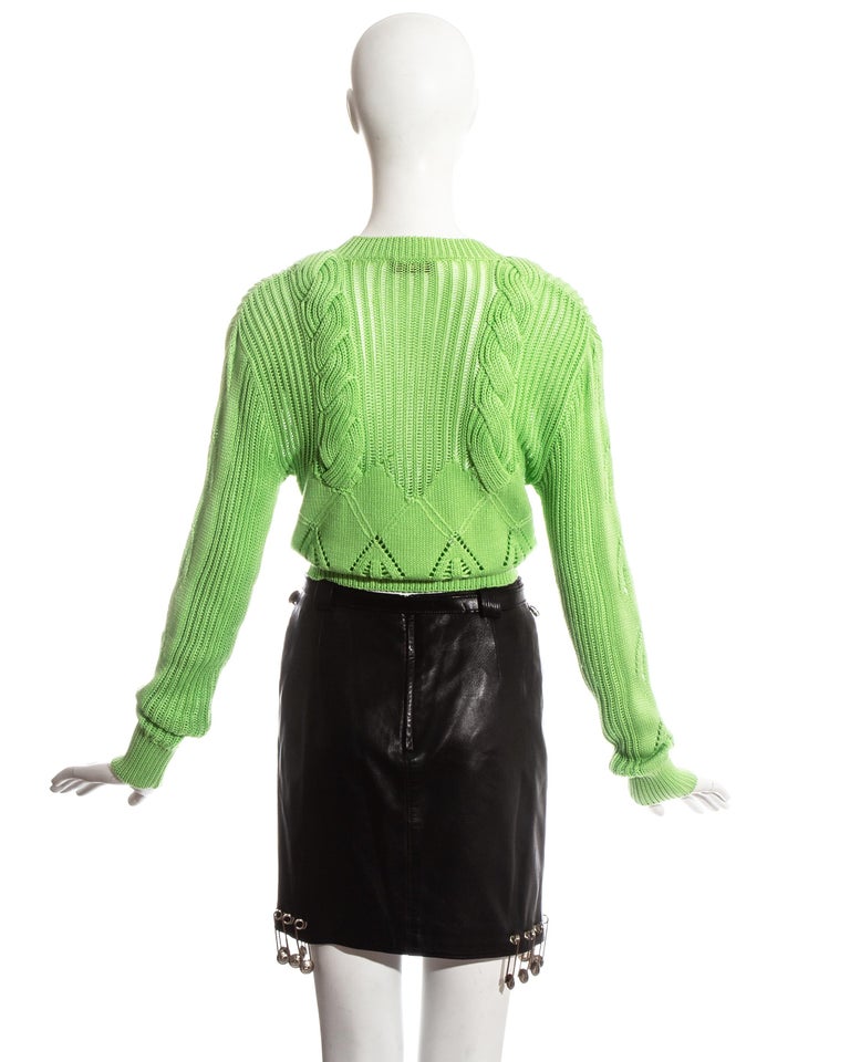 Gianni Versace black safety pin skirt and neon green sweater ensemble
