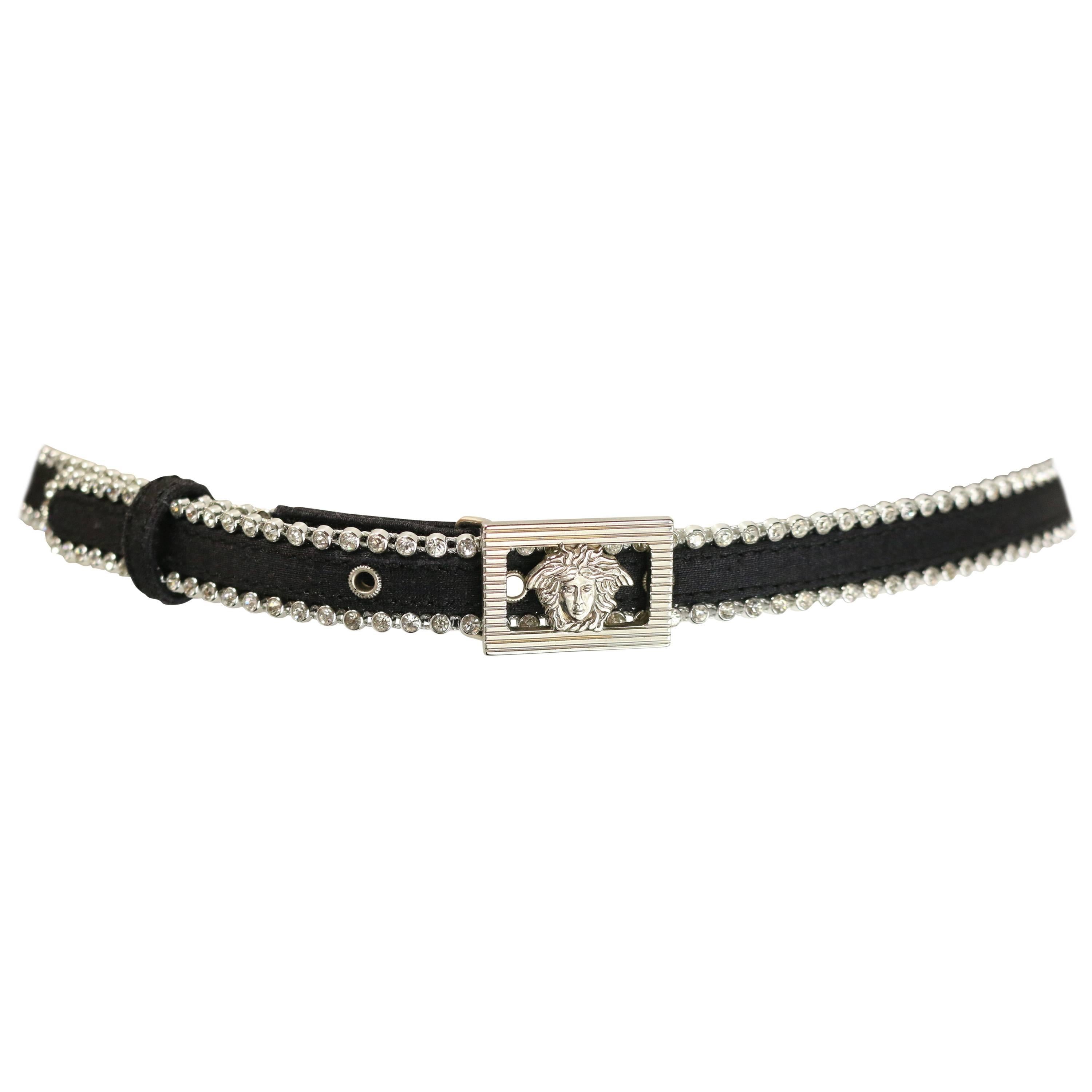 - Vintage 90s Gianni Versace black silk and rhinestone trim with silver medusa buckle closure belt. 

- Made in Italy. 

- Size 75/30. 

