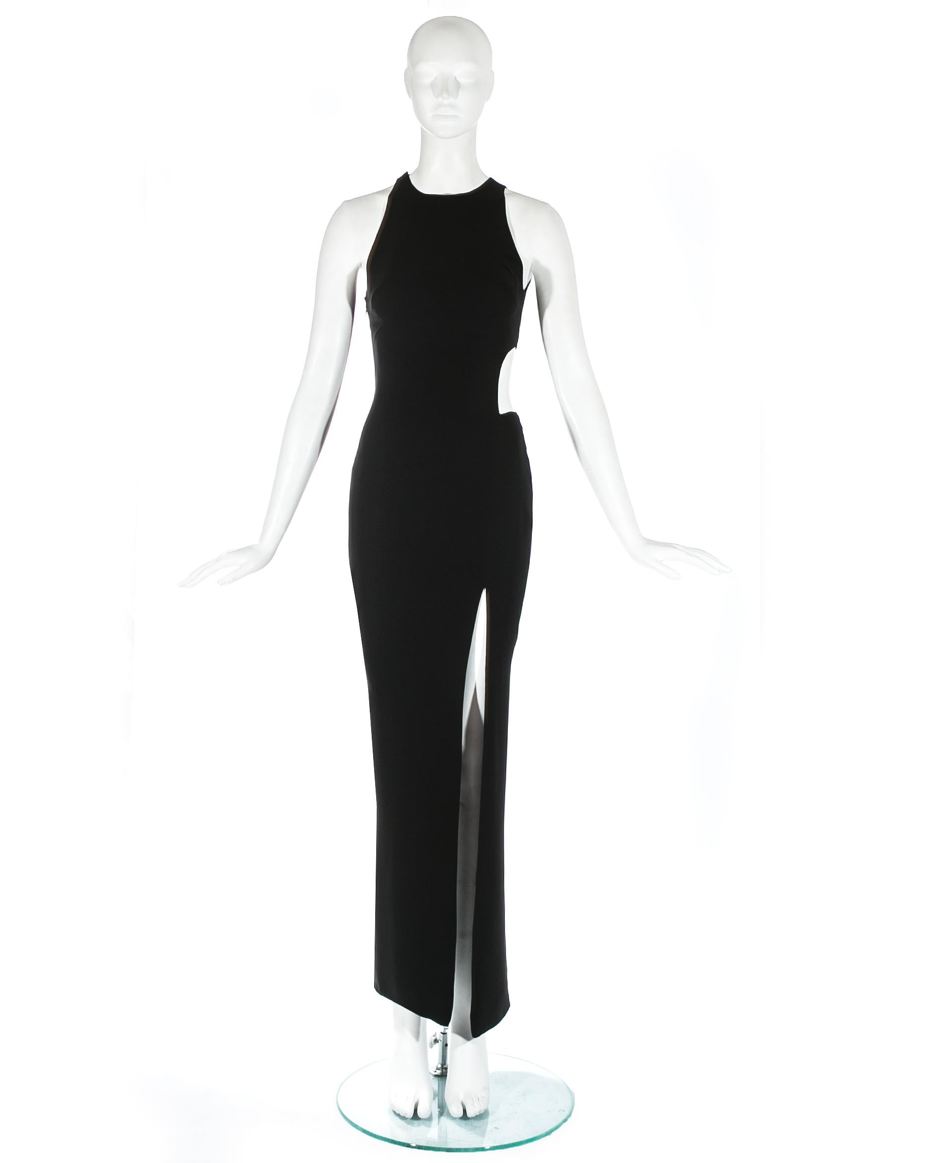 Gianni Versace; black silk evening dress with high leg slit and large cut out on the waist. Silk lining throughout. 

Spring-Summer 1998