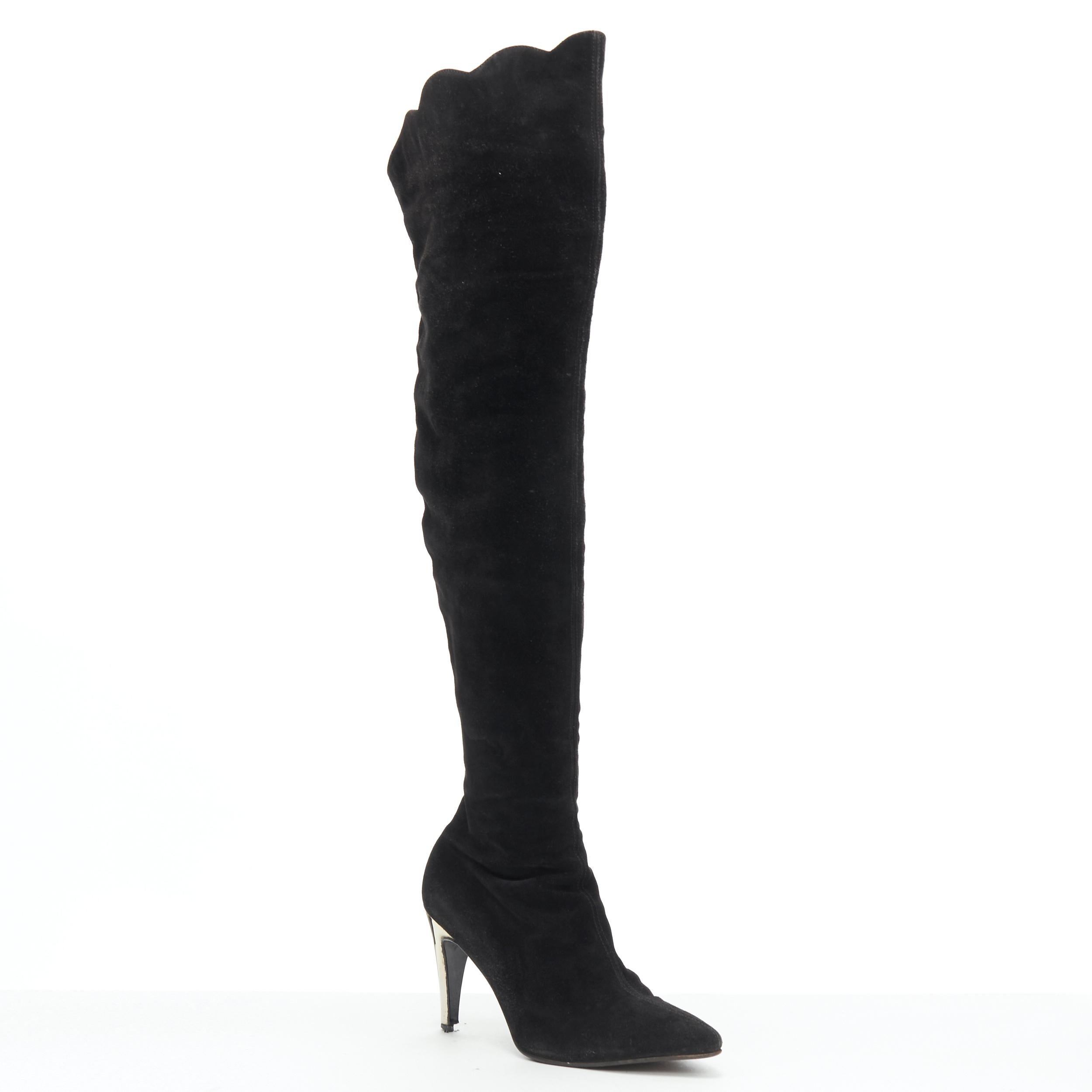 GIANNI VERSACE black suede scalloped topline gold heel pointy knee boot EU37 
Reference: GIYG/A00117 
Brand: Gianni Versace 
Designer: Gianni Versace 
Material: Suede 
Color: Black 
Pattern: Solid 
Closure: Zip 
Extra Detail: Scalloped top line.
