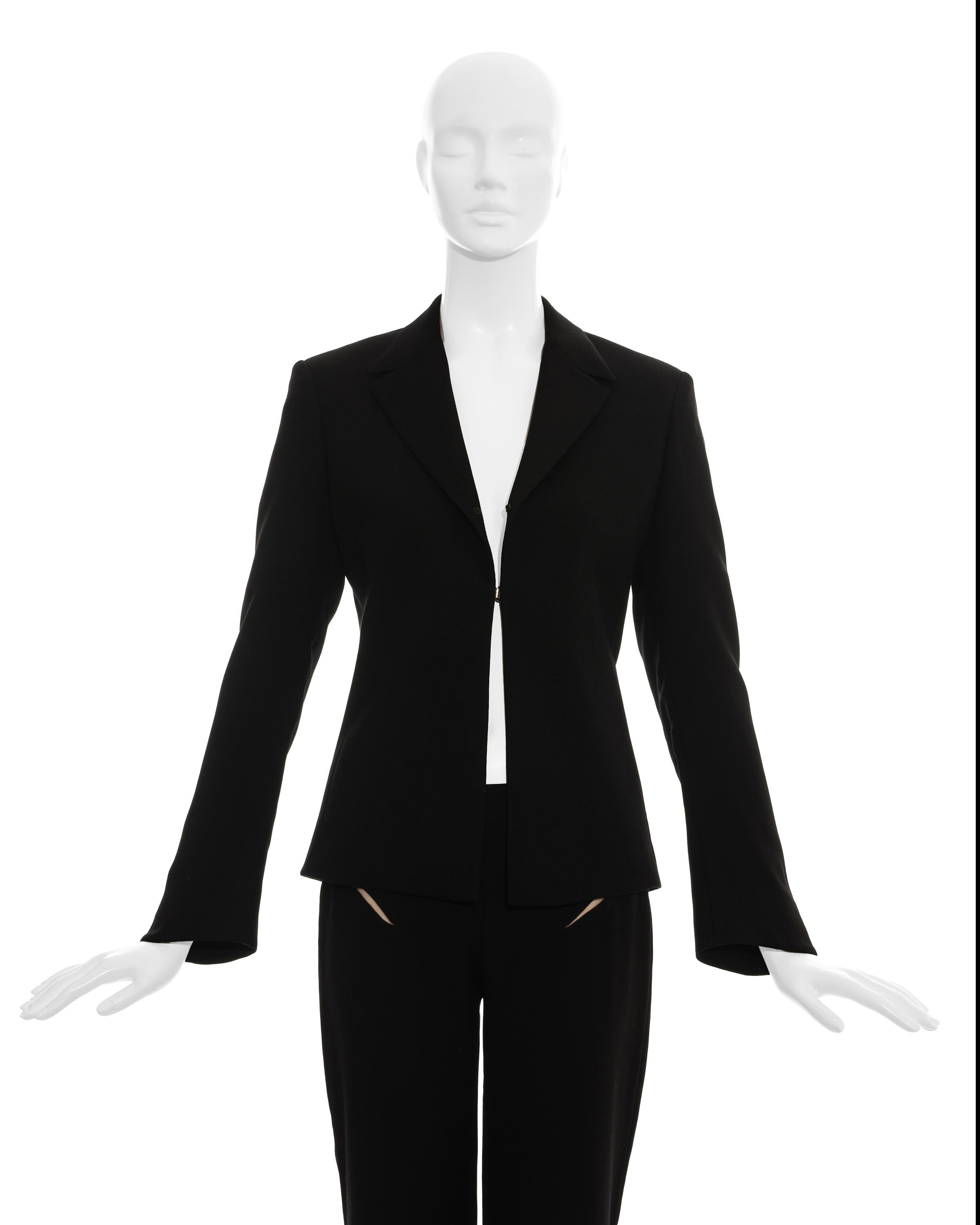 Gianni Versace Couture black pant suit in light wool with flesh-coloured mesh inserts

Spring-summer 1998