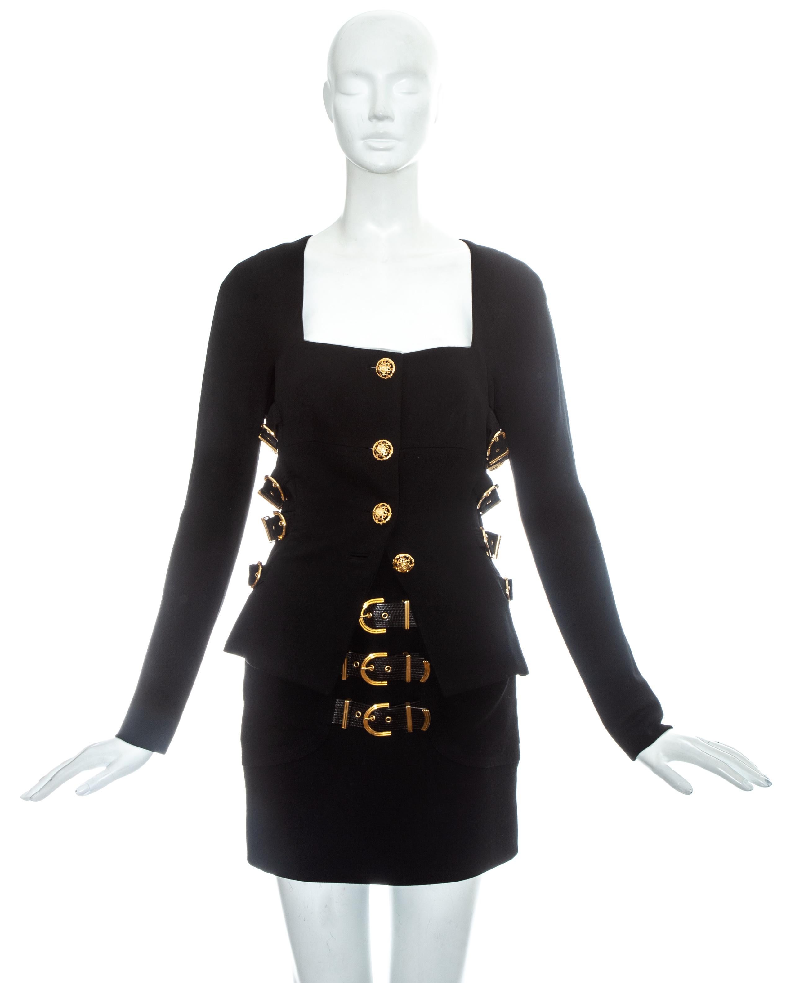 Gianni Versace black wool skirt suit with signature Versace gold bondage buckles.

Fall-Winter 1992