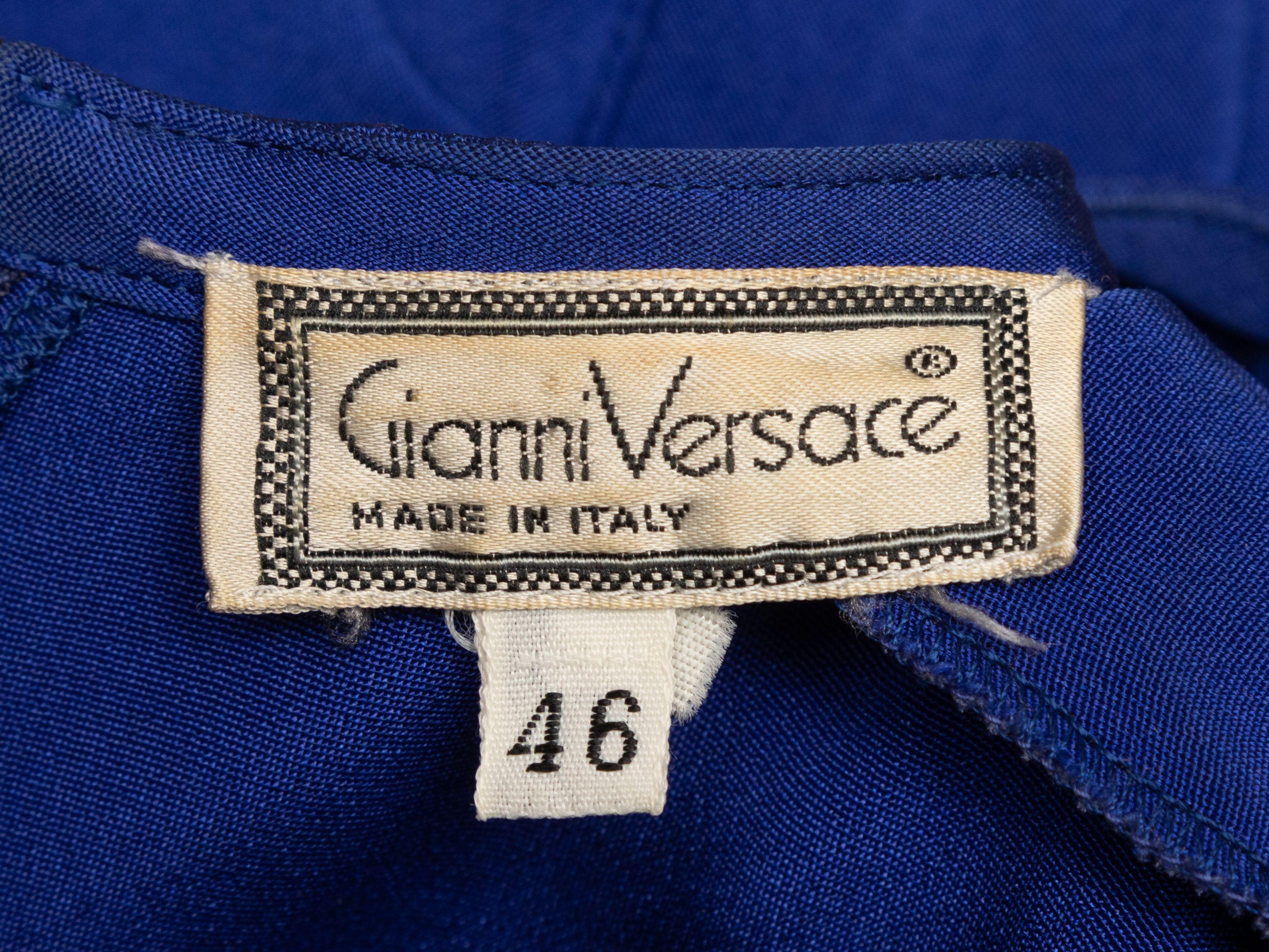 Product Details: Vintage blue long sleeve knee-length dress by Gianni Versace. Crew neck. Tie accent at side. Zip closure at back. Designer size 46. 38