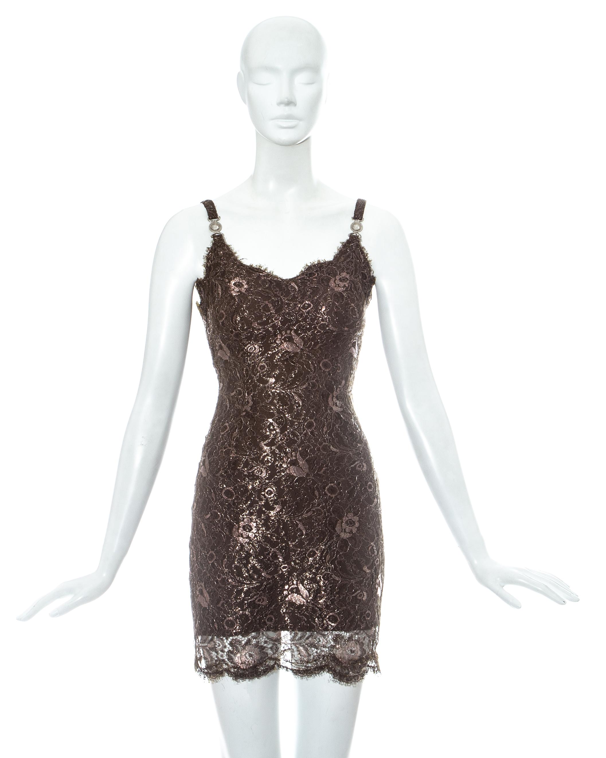 Gianni Versace brown lame lace figure hugging mini dress with silk lining. Signature Versace Medusa clasps on shoulder straps and side seam zip fasteinng.

Fall-Winter 1996