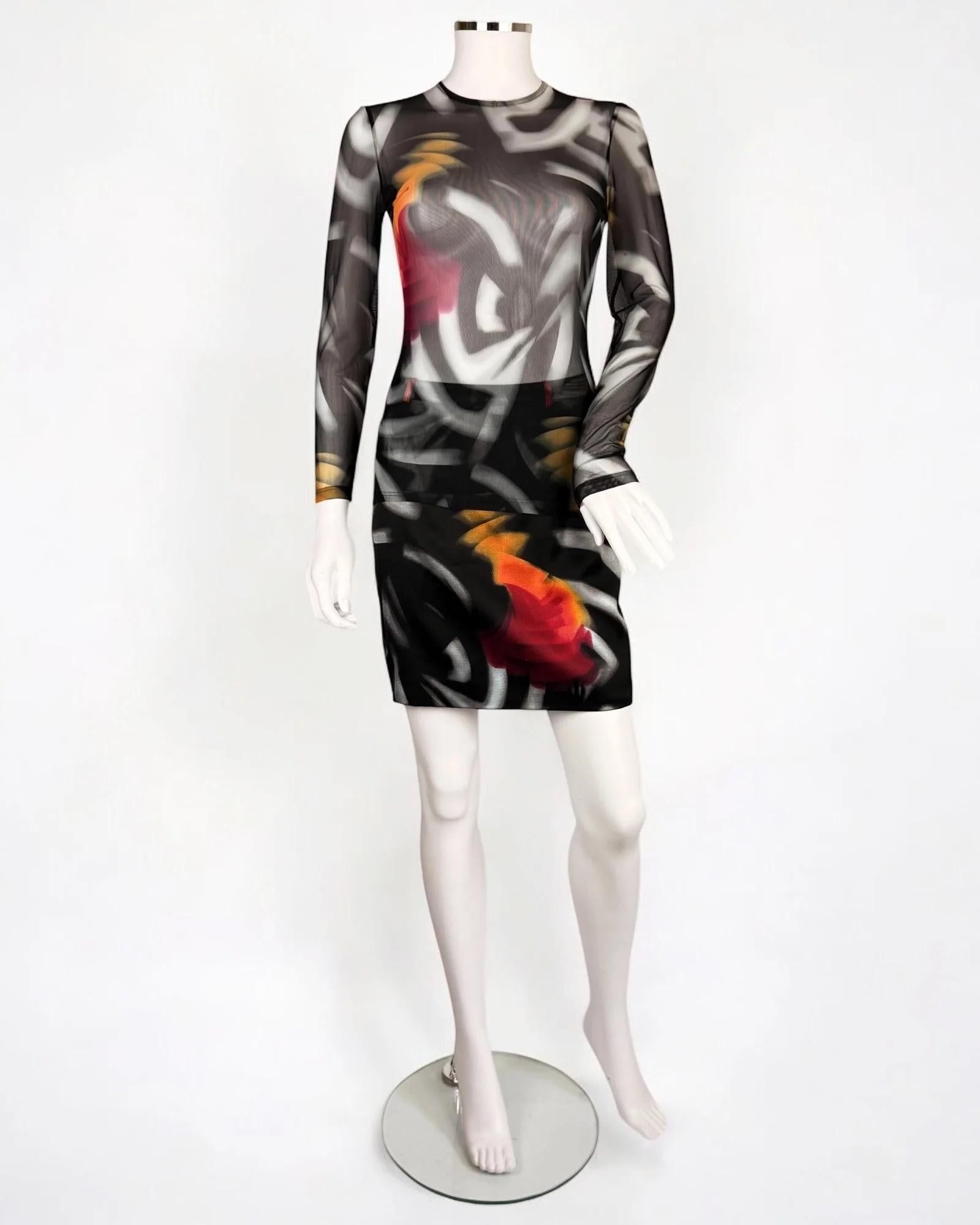 Gianni Versace by Donatella Versace abstract mini skirt and mesh long sleeved top, Fall Winter 1999
Both pieces featured on the runway in different looks
Mesh top zips up at back
Skirt does up with side zip
Good vintage condition 

Size:
Skirt IT 38