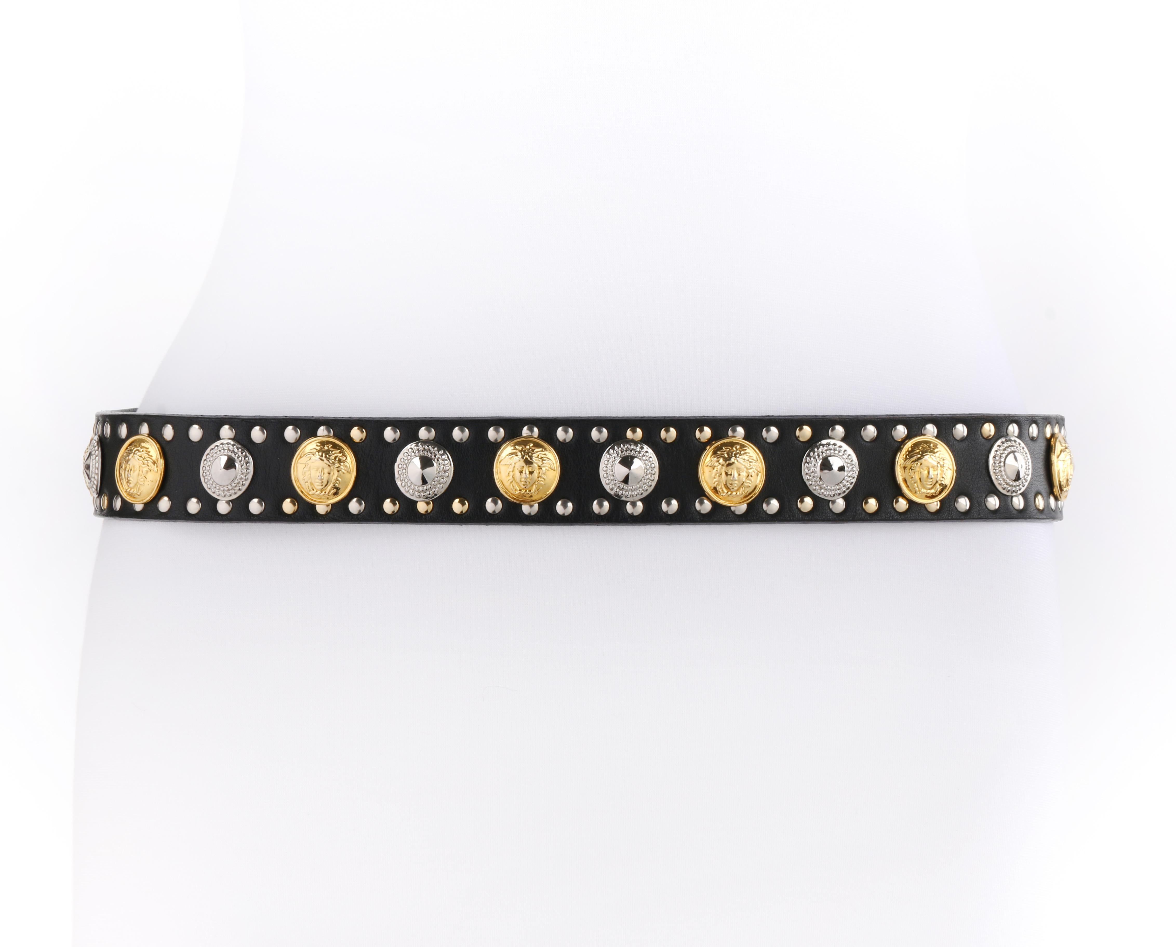 GIANNI VERSACE c.1990 Black Leather Gorgon Medusa Medallion Studded Waist Belt
 
Circa: 1990’s 
Label(s): Gianni Versace
Designer: Gianni Versace
Style: Waist belt
Color(s): Black (belt), shades of gold and silver (hardware)
Lined: Yes
Unmarked