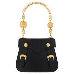 Gianni Versace - Petit sac à main en cuir noir avec boucles et Méduses dorées, circa 1990