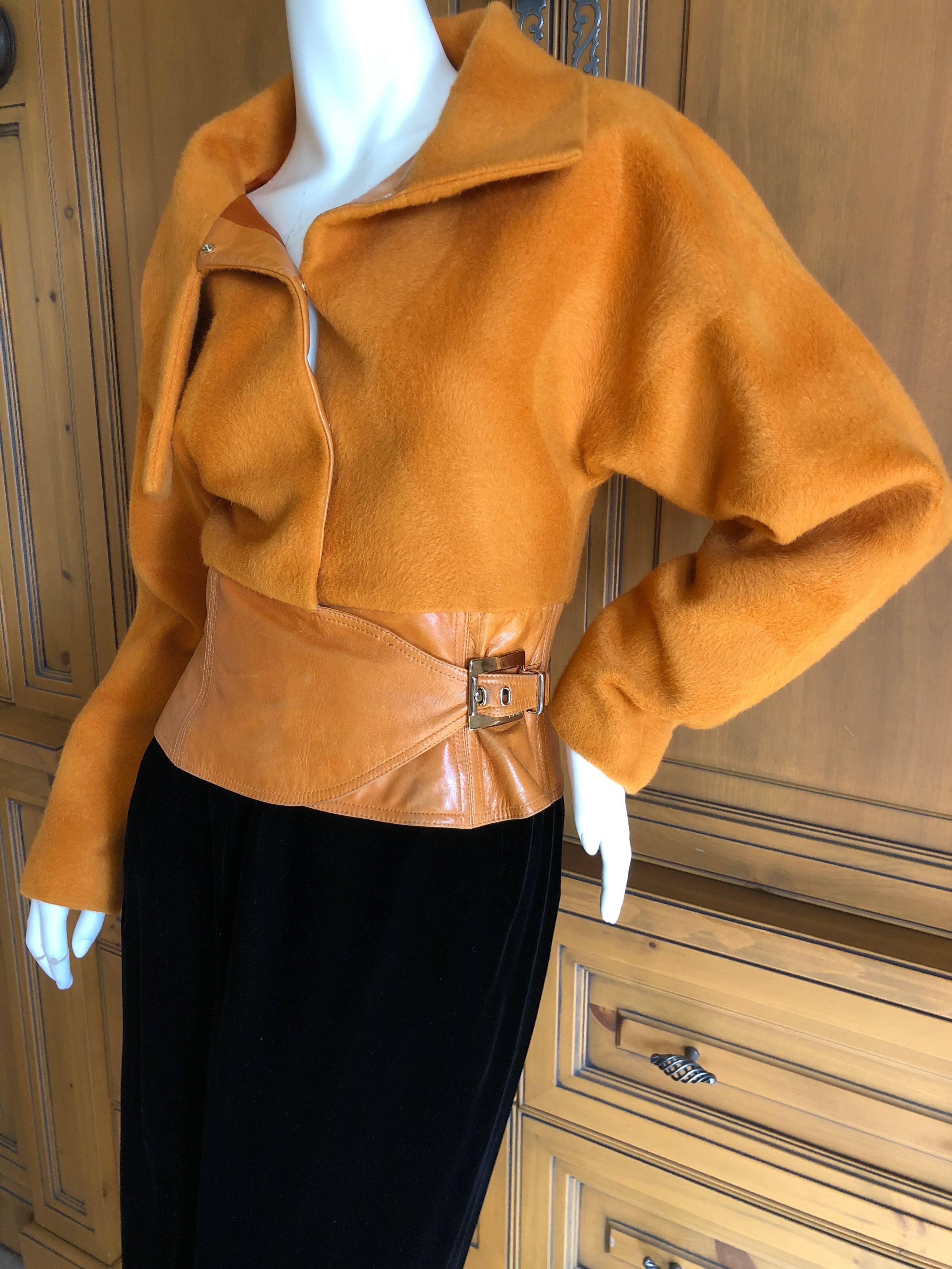 Gianni Versace Couture 1980's Luxurious Orange Wrap Jacket with Leather Trim.

So beautiful, perfect gift for  the Versace lover.
 
Size 38
Bust 36