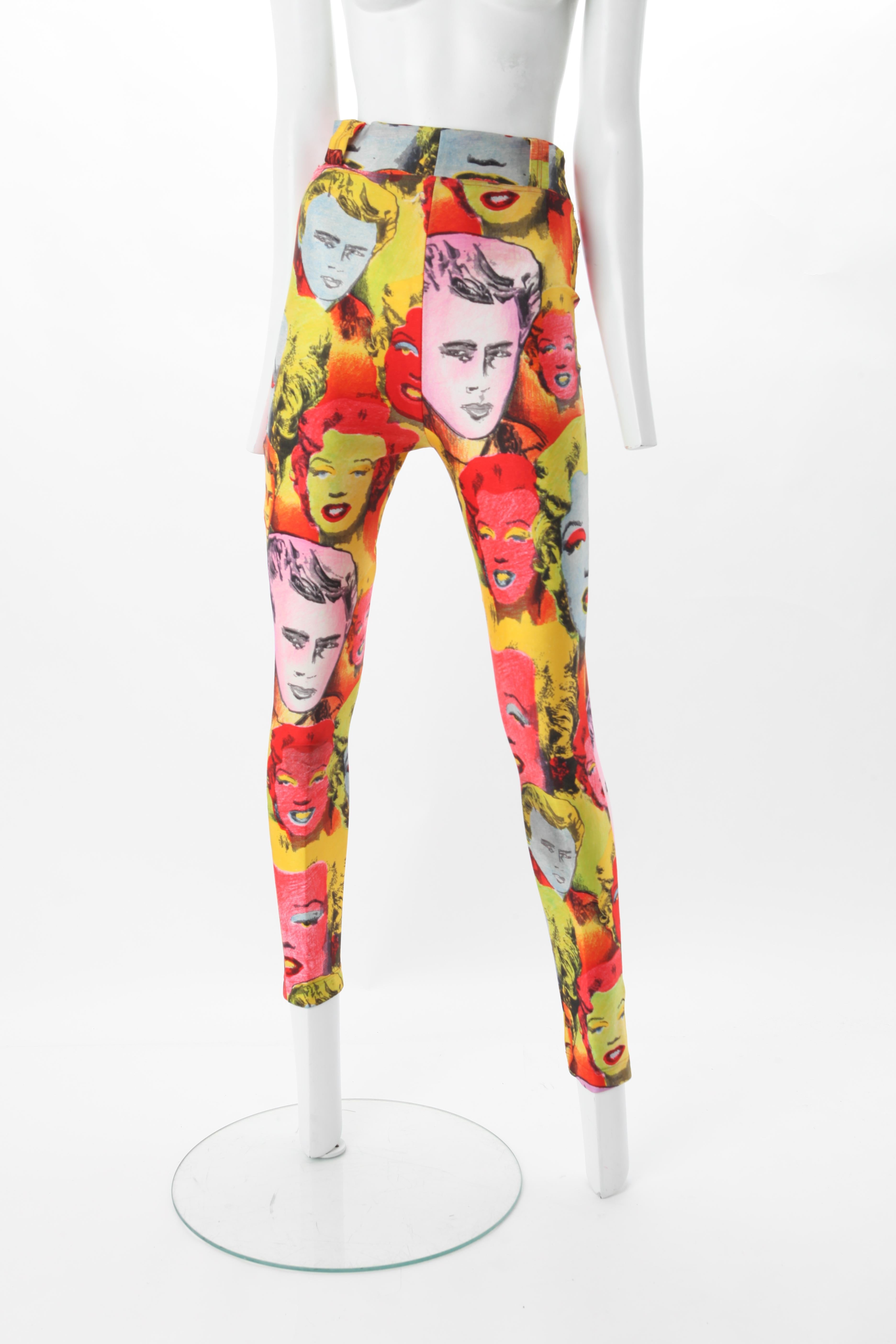 Gianni Versace Couture Andy Warhol Screen Printed Legging, c.1990.
Gianni Versace high waisted leggings fashioned of silk and lycra spandex featuring the famous pop art Andy Warhol images of dead Hollywood icons Marilyn Monroe and James Dean. 
Fits