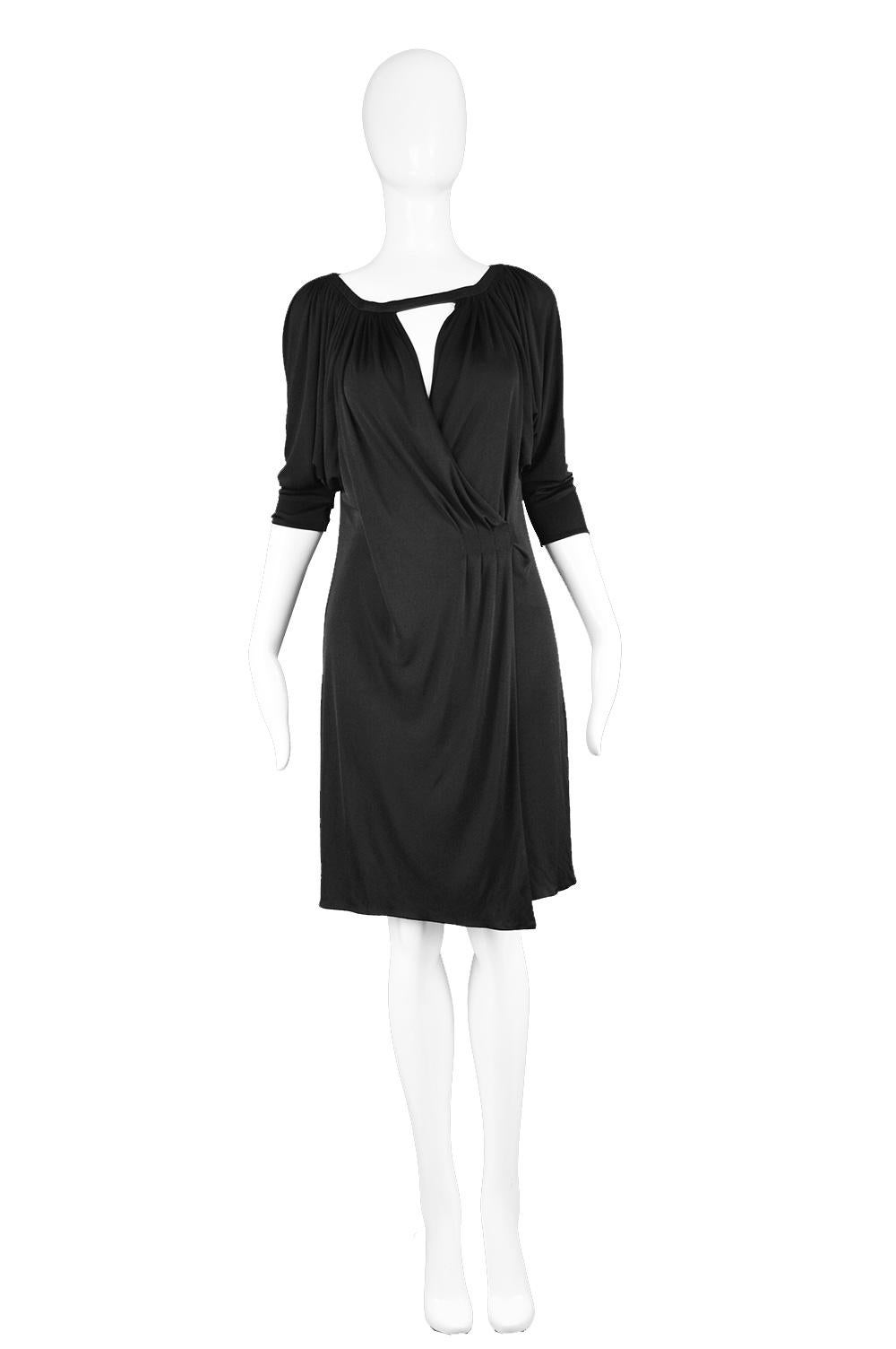 A fabulous vintage women's little black dress from the Spring 2001 collection by luxury Italian fashion designer, Donatella Versace for Gianni Versace Couture. In a fluid black jersey that gives incredible drape and a timeless look. With a batwing