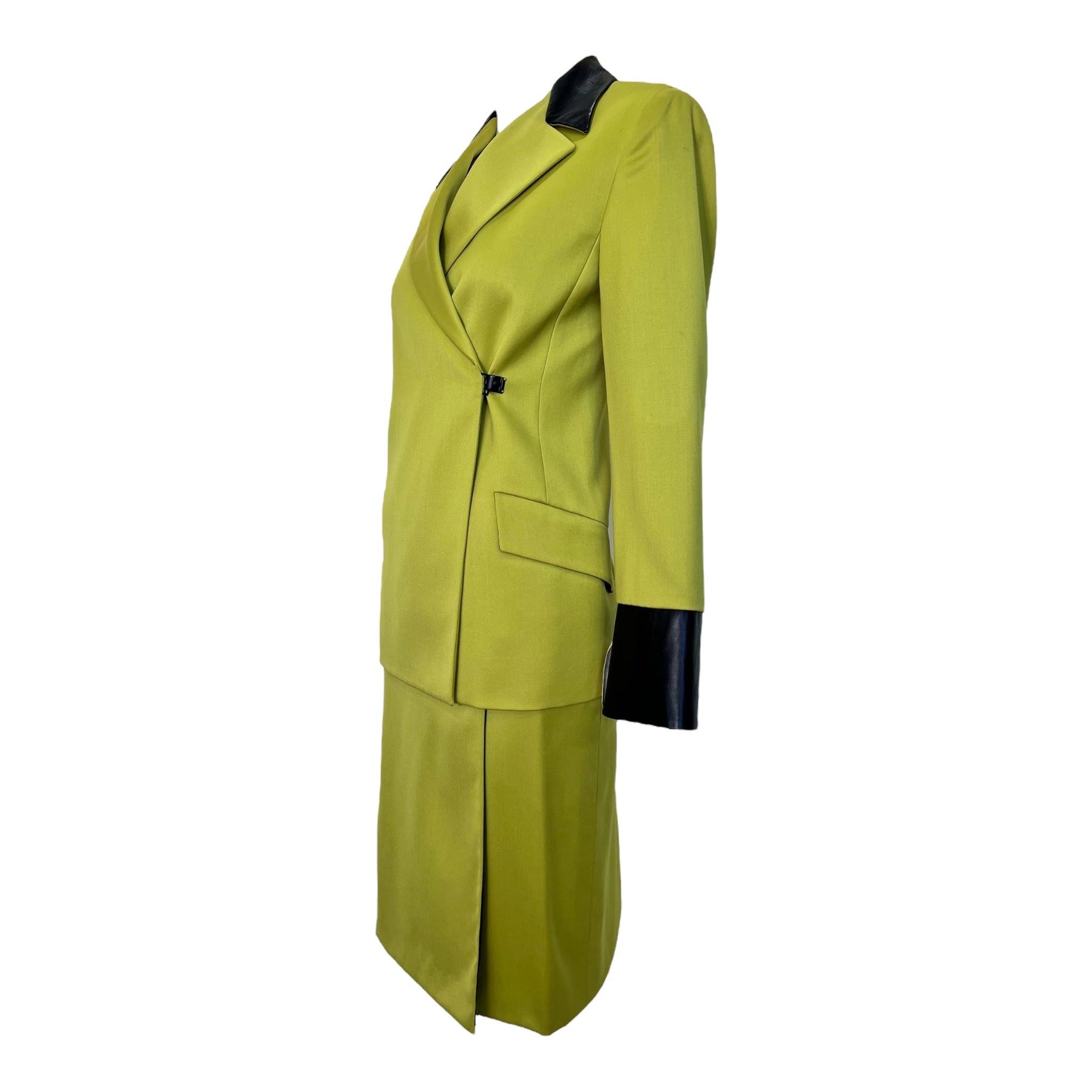 Gianni Versace Couture skirt suit from 1998. Electric chartreuse green and black color-blocking. Sleek and  futuristic. So very Y2K. Black Medusa toggle buttons at side waist on the jacket and at the side hip and low hip on skirt. Silky smooth wool.