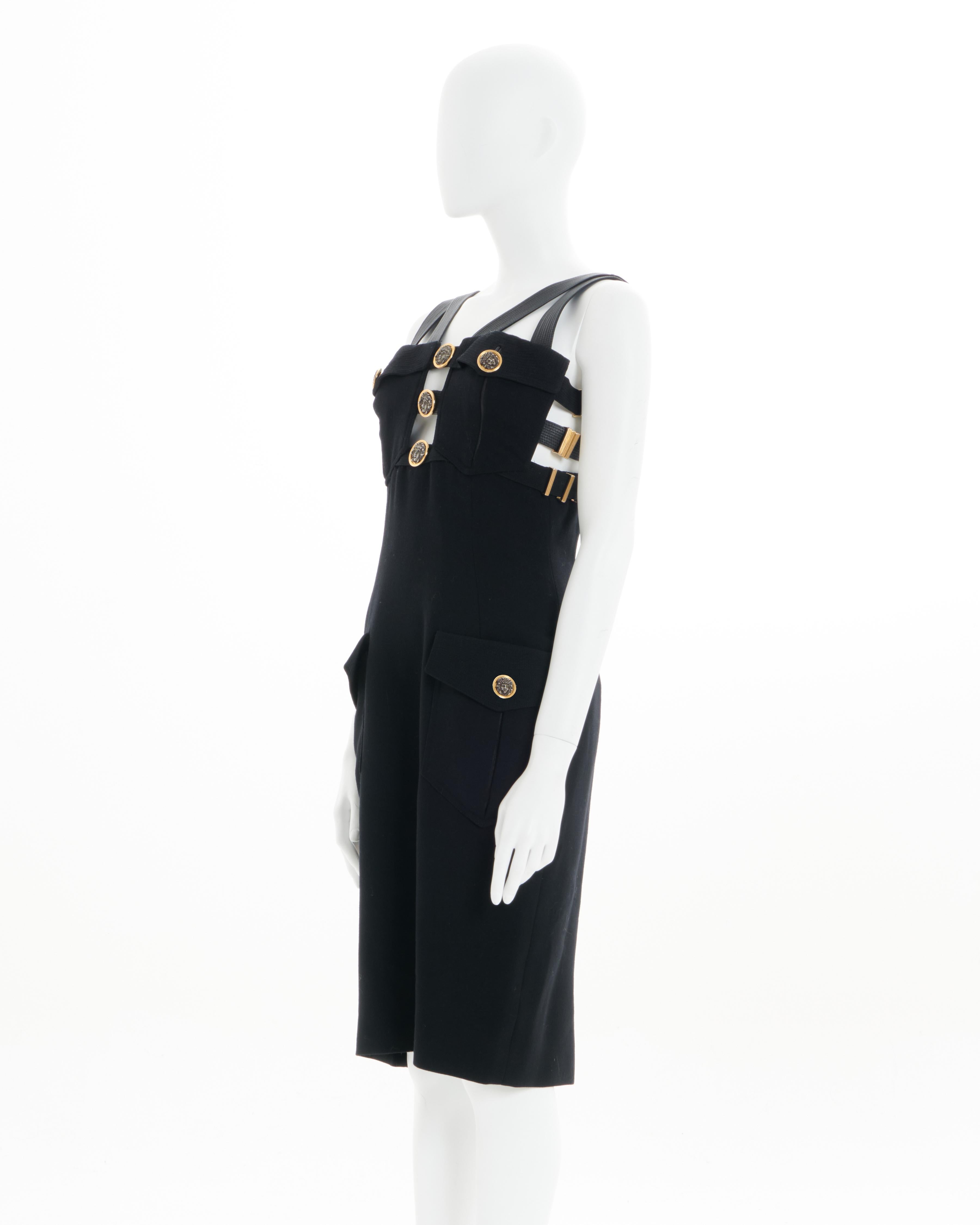 - ‘Miss S&M’ collection 
- Sold by Skof.Archive
- Designed by Gianni Versace
- Bondage style bustier with topstitched leather shoulder straps 
- Decorative medusa buttons 
- Gilded buckle straps at the sides and back 
- Four front flap pockets 
-