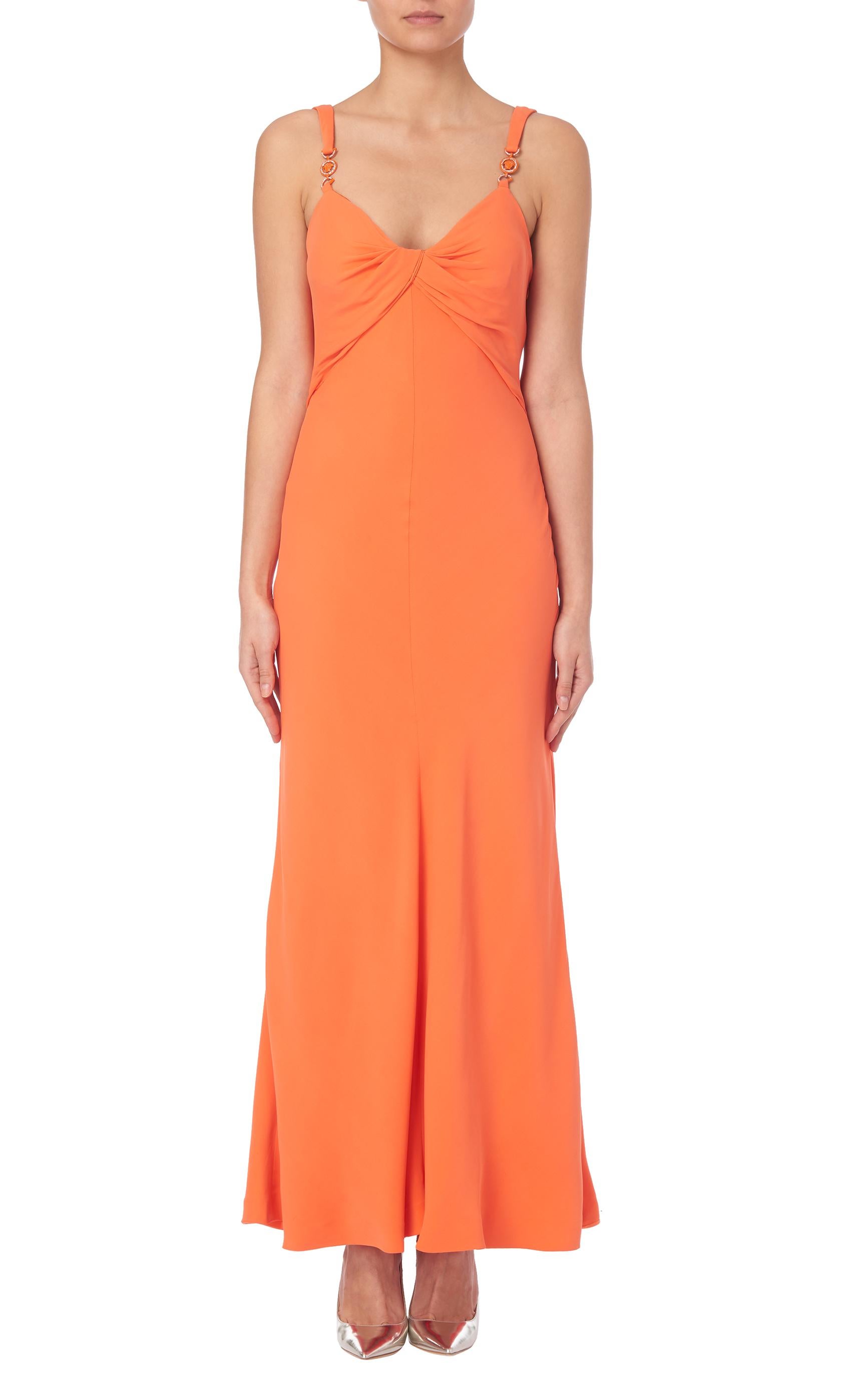 This Gianni Versace Couture stunning orange evening gown was featured in the advertising campaign for the Spring/Summer 1996 collection, and was later worn by Monica Bellucci. This silk blend maxi dress is slim fitting and features a sweetheart
